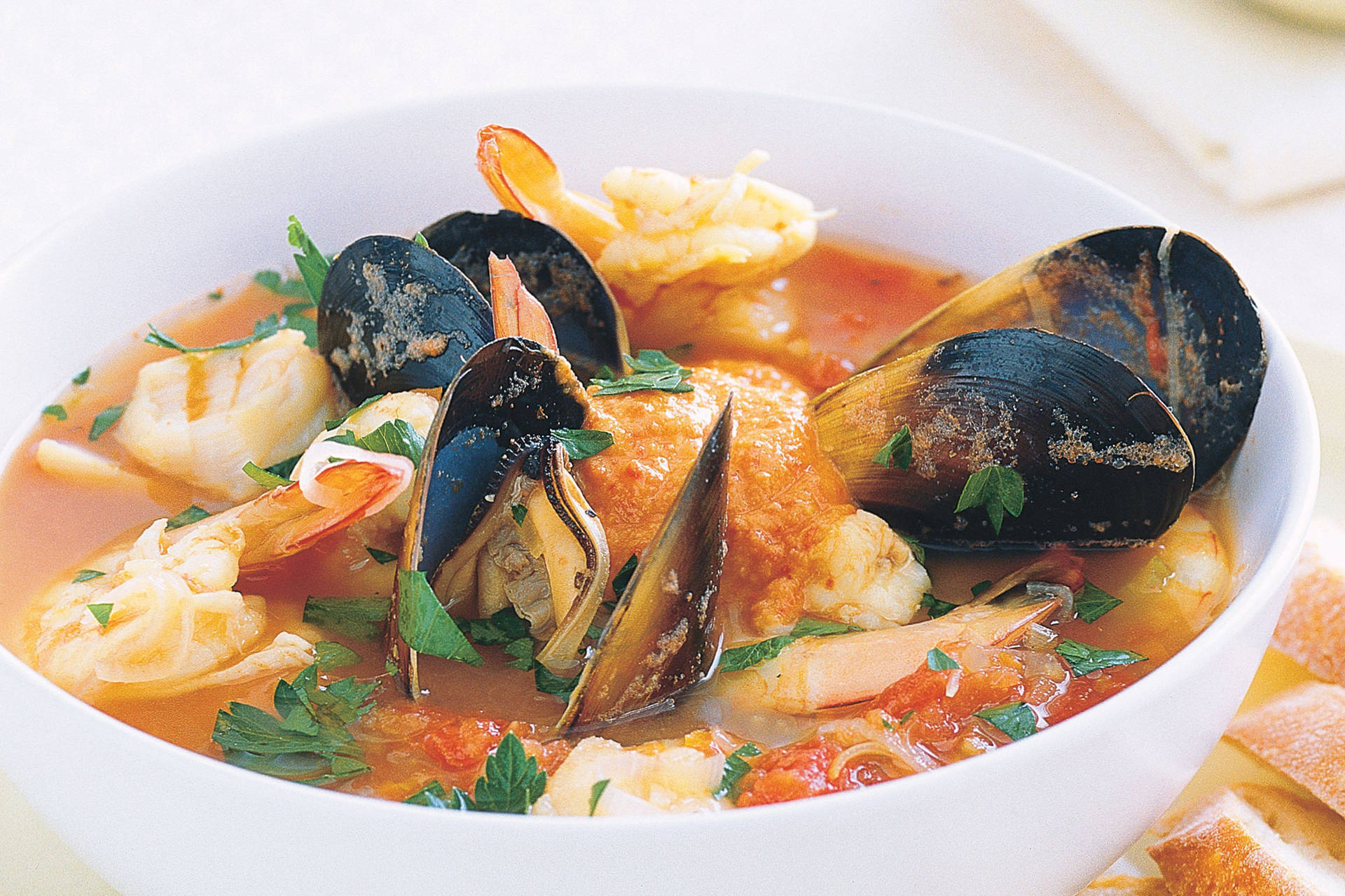 Caption: Authentic French Bouillabaisse Served In A Ceramic Bowl Background