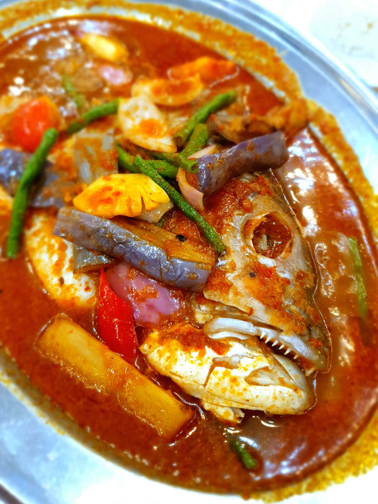 Caption: Authentic Thai-style Fish Head Curry Background