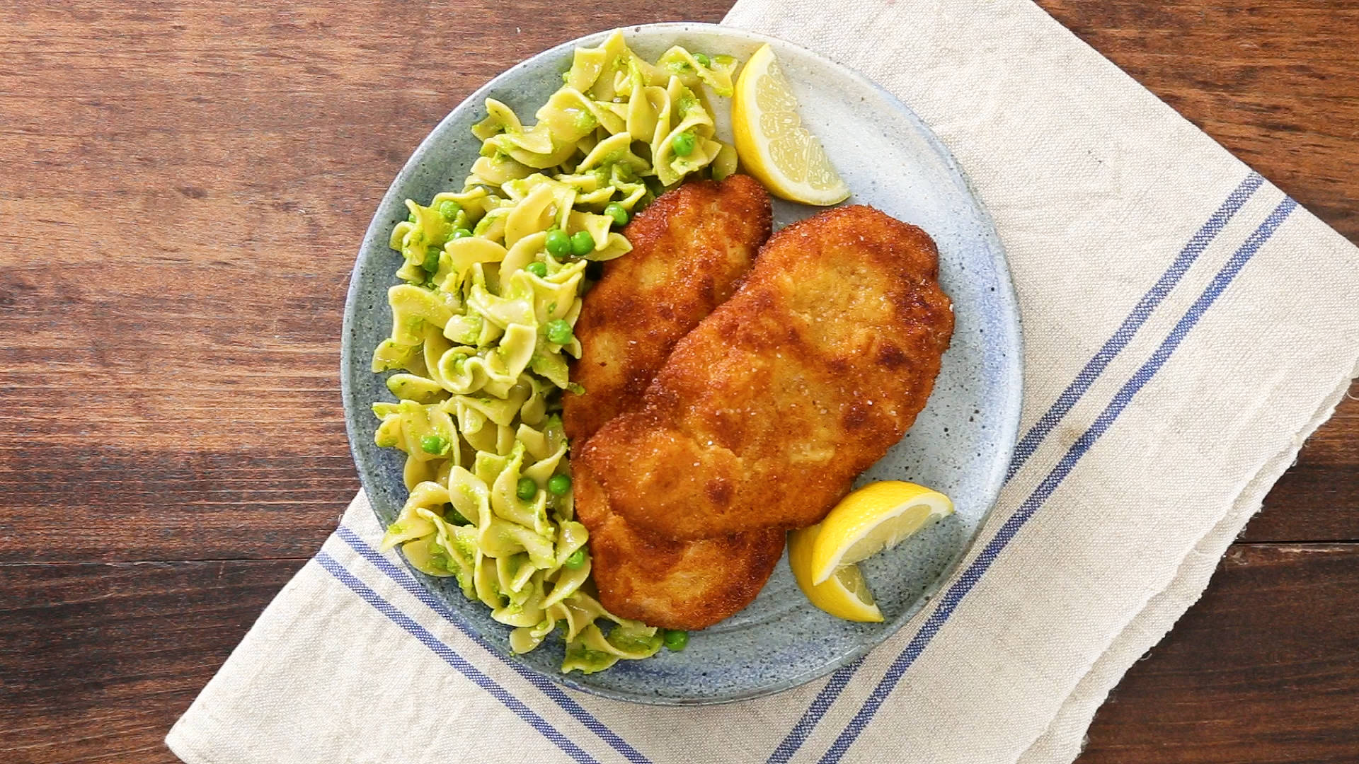 Caption: Authentic Wiener Schnitzel Served With Pasta Background