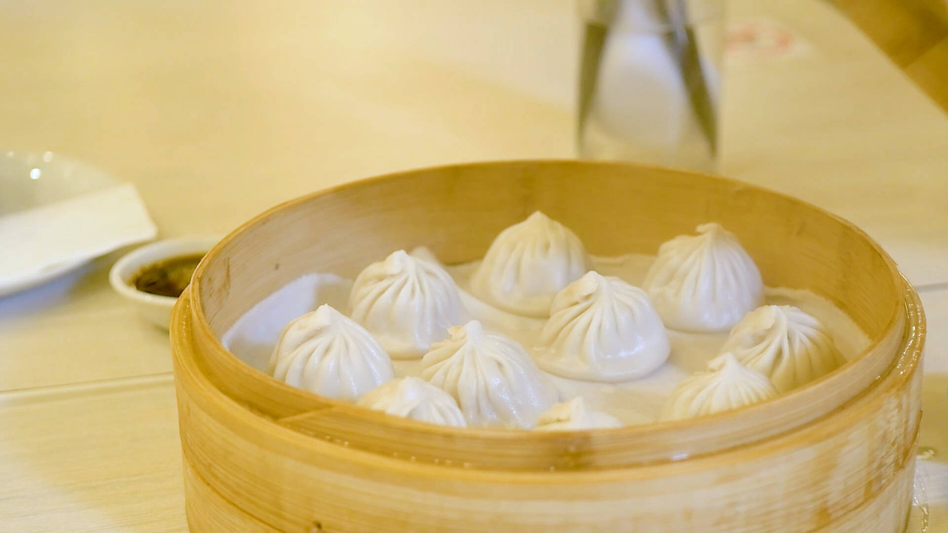 Caption: Authentic Xiaolongbao - Delicious Chinese Mini Dumpling In A Bamboo Steamer Background