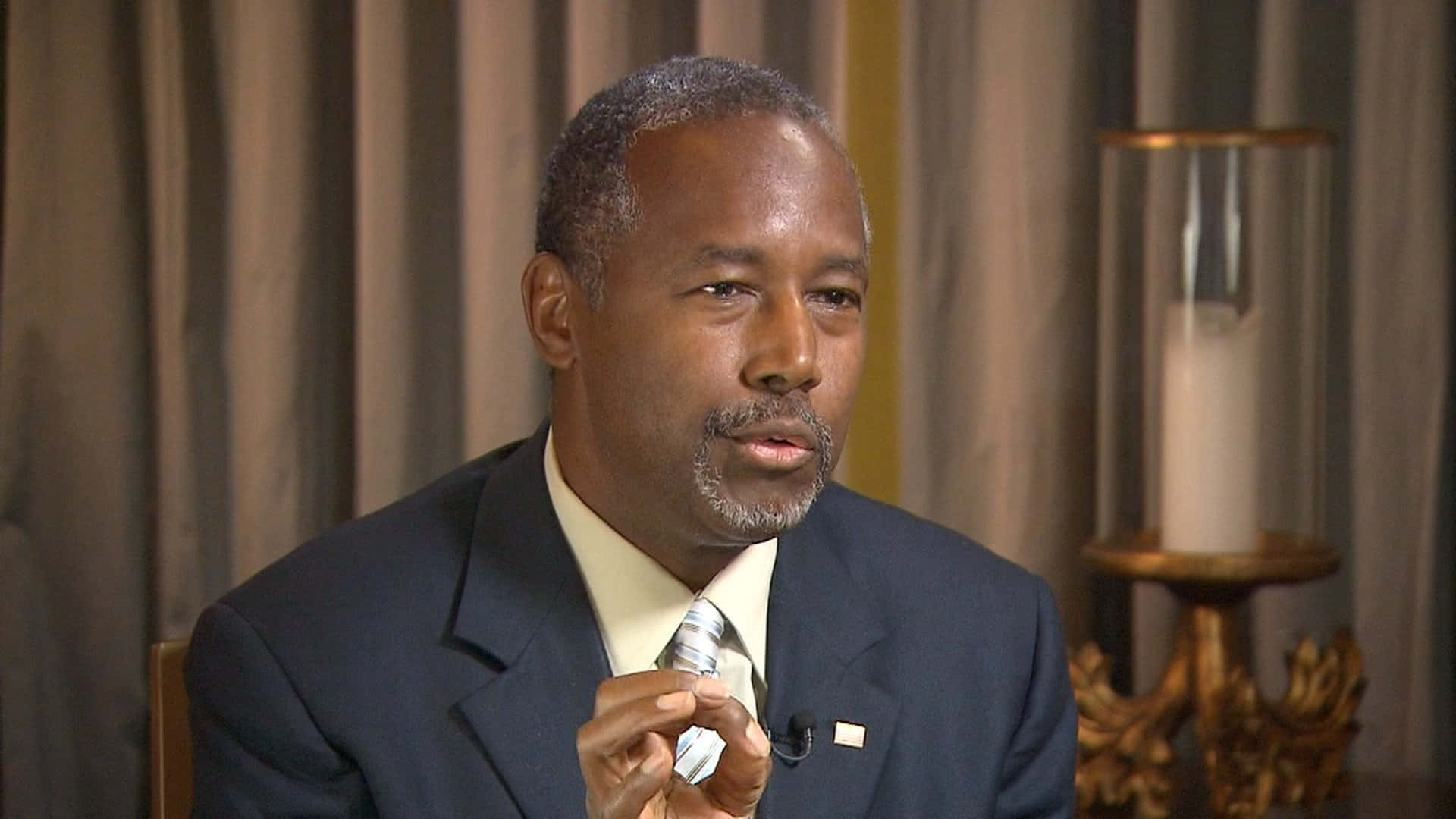 Caption: Ben Carson Engaged In Discussion Background
