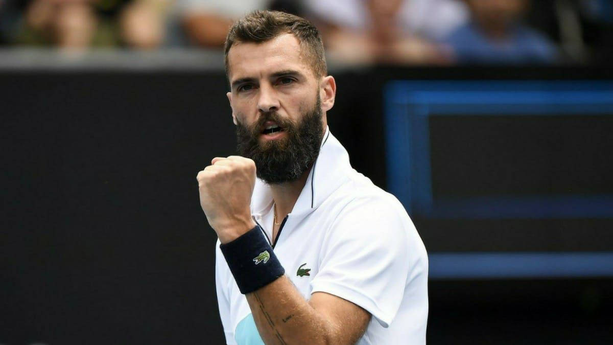 Caption: Benoit Paire In Action On The Tennis Court Background