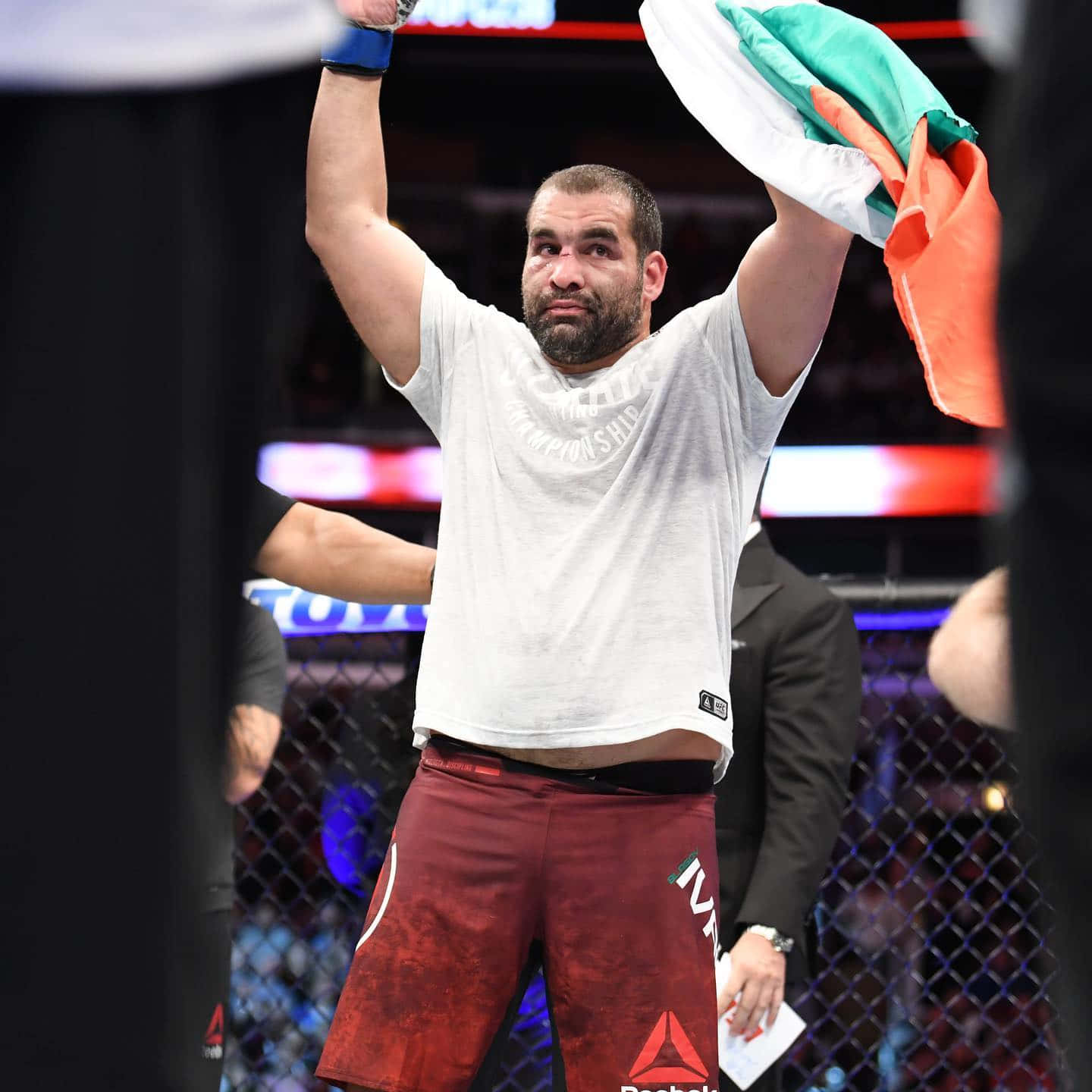 Caption: Blagoy Ivanov Triumphantly Holding Bulgarian Flag Background