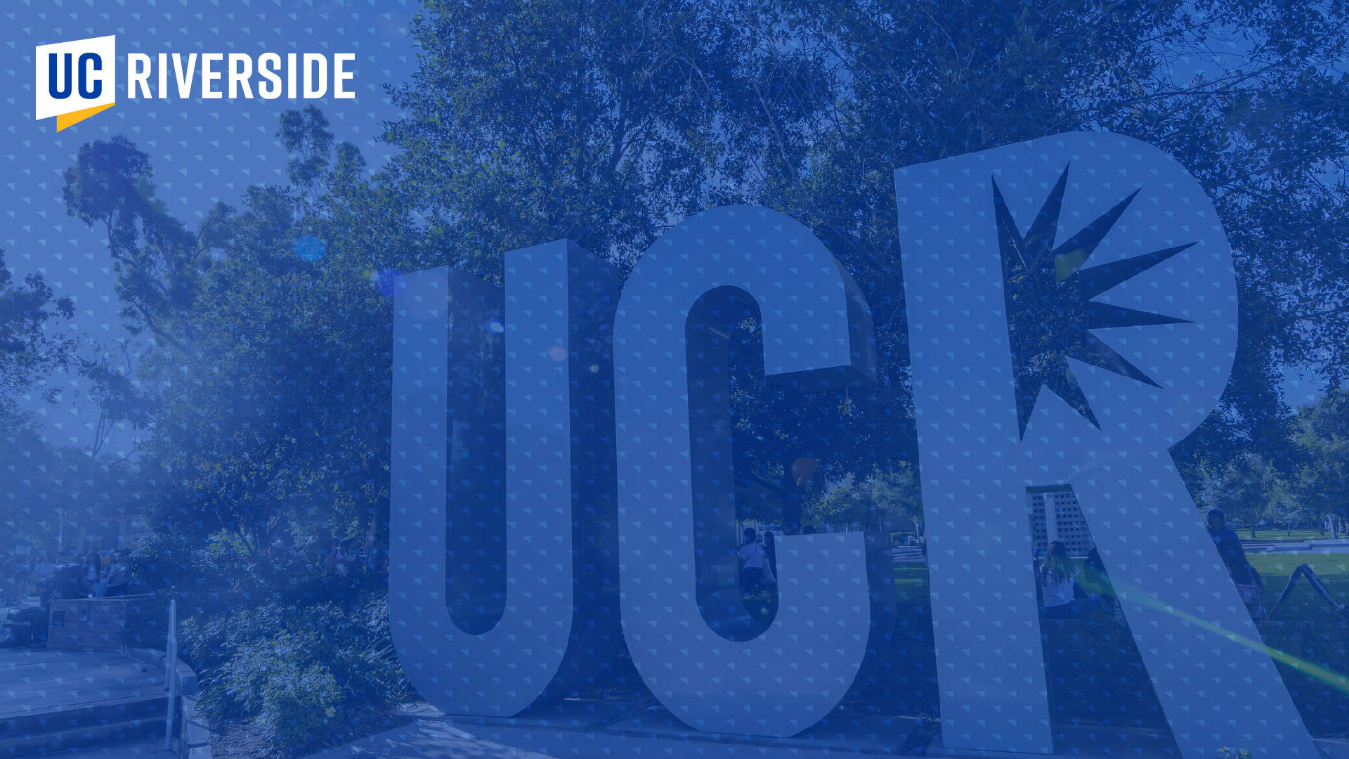 Caption: Blue Hued Image Of Ucr Campus Entrance Sign