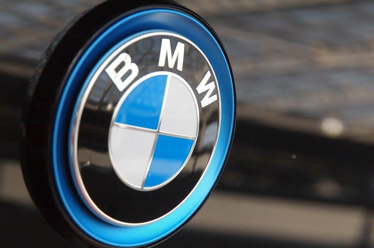Caption: Bmw Logo On A Spotlighted Backdrop Background