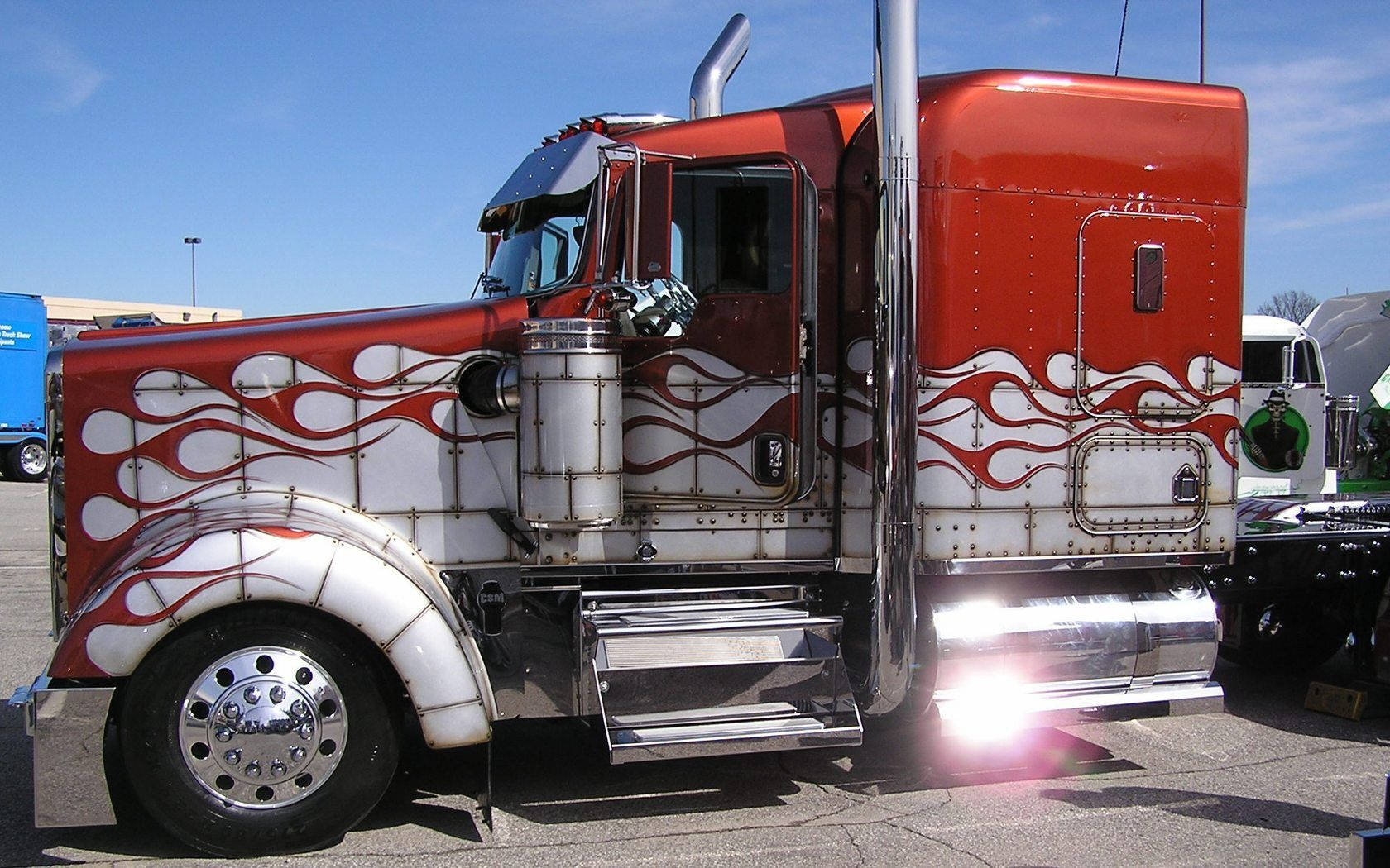 Caption: Bold Red Kenworth Truck In Its Flame Design Background