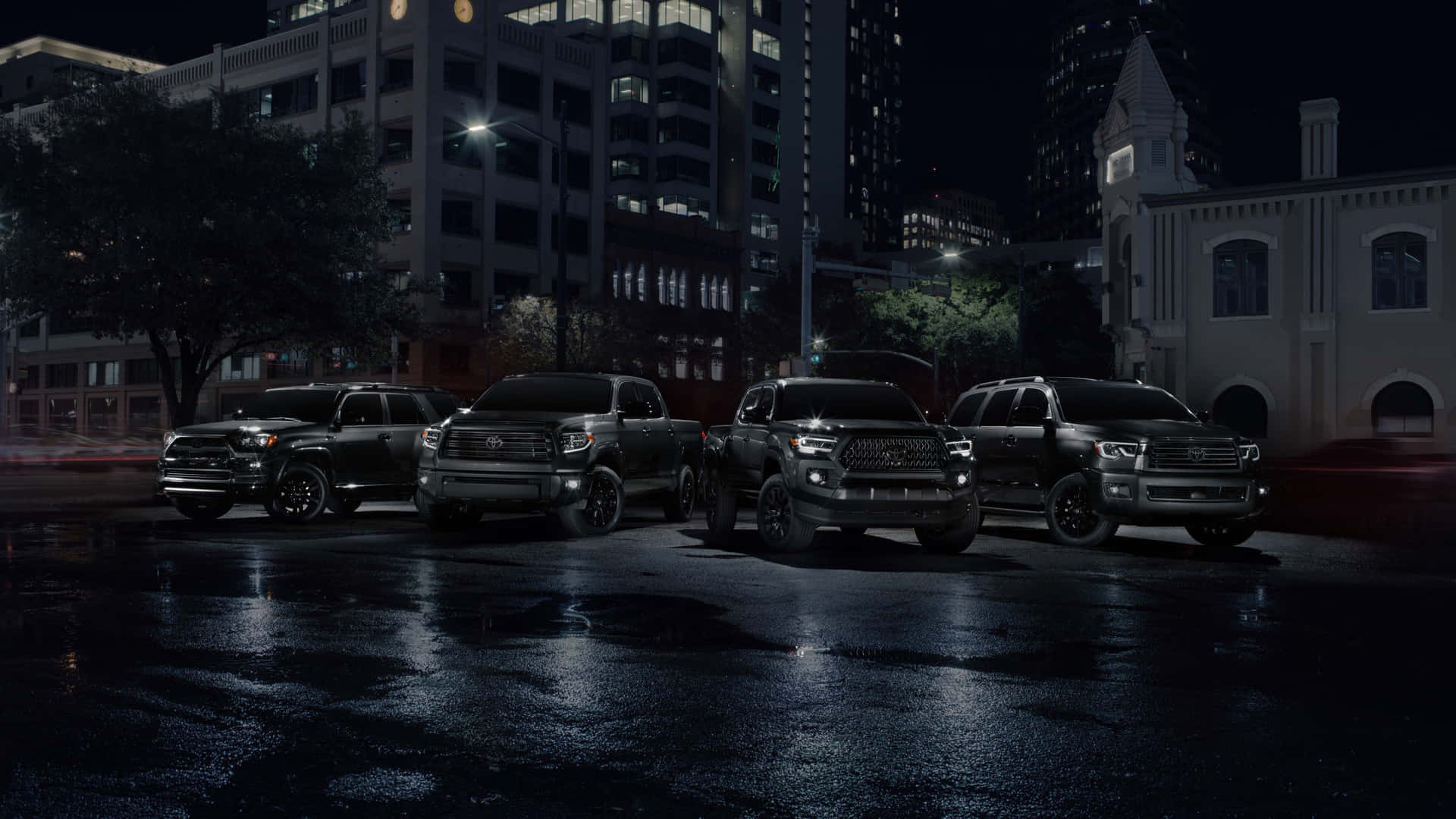 Caption: Bold Stance Of Black Tundra Trucks Against The Majestic Backdrop