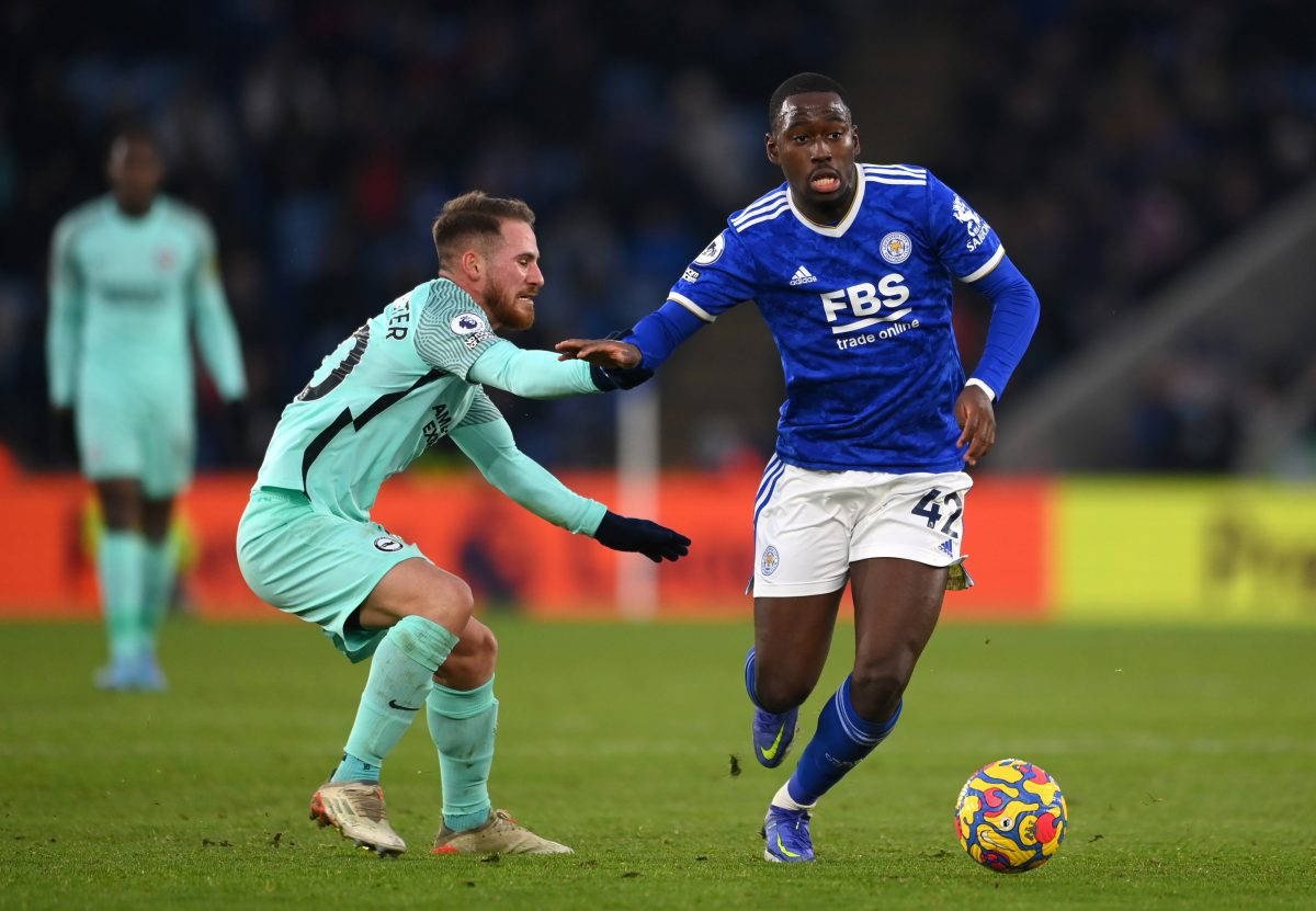 Caption: Boubakary Soumare In Action On The Football Pitch Background