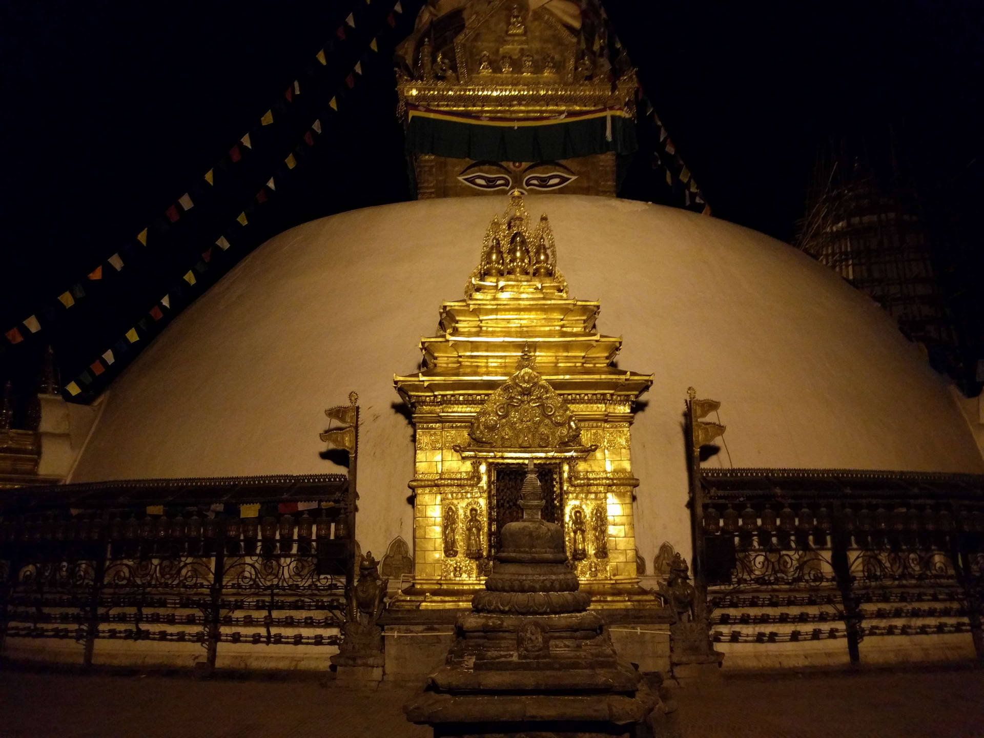 Caption: Boudhanath Stupa Glowing At Night In Kathmandu, Nepal Background