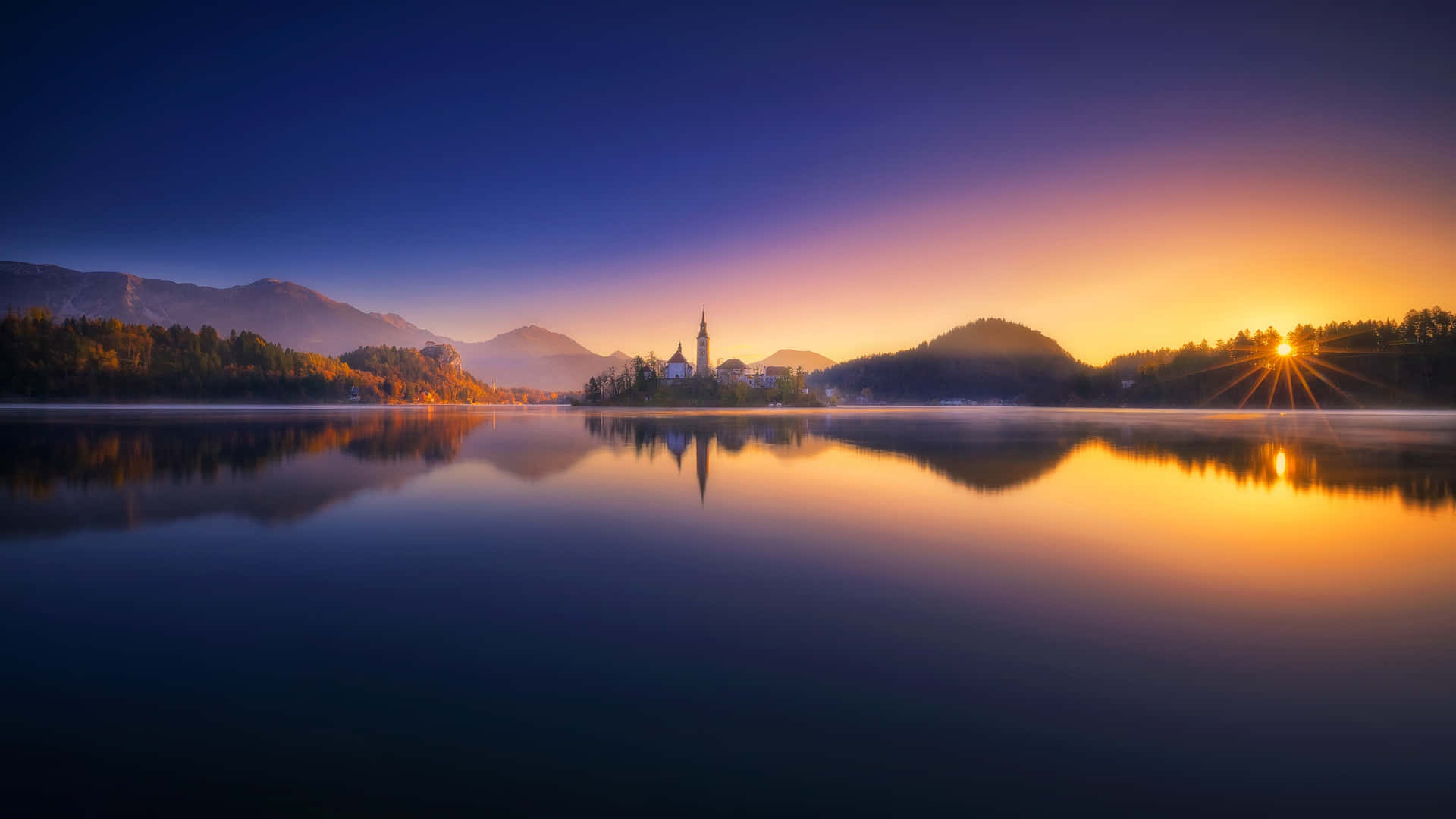 Caption: Breathtaking Sunset Over Lake Bled Panorama
