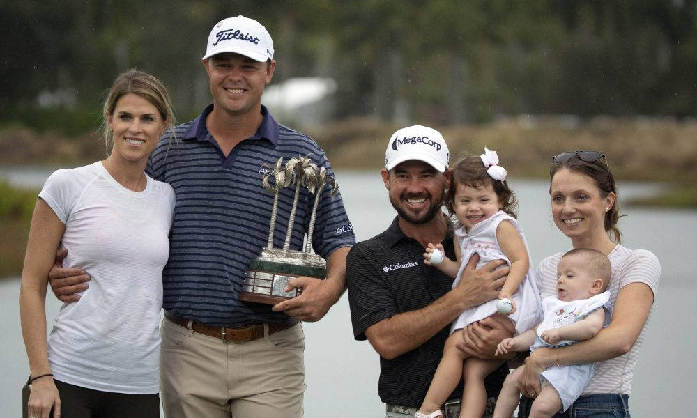 Caption: Brian Harman, Patton Kizzire And Their Families On A Golf Course. Background