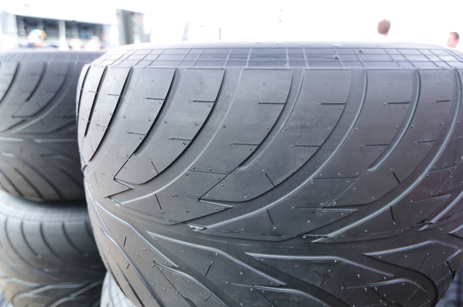 Caption: Bridgestone High-performance Auto Tire Background