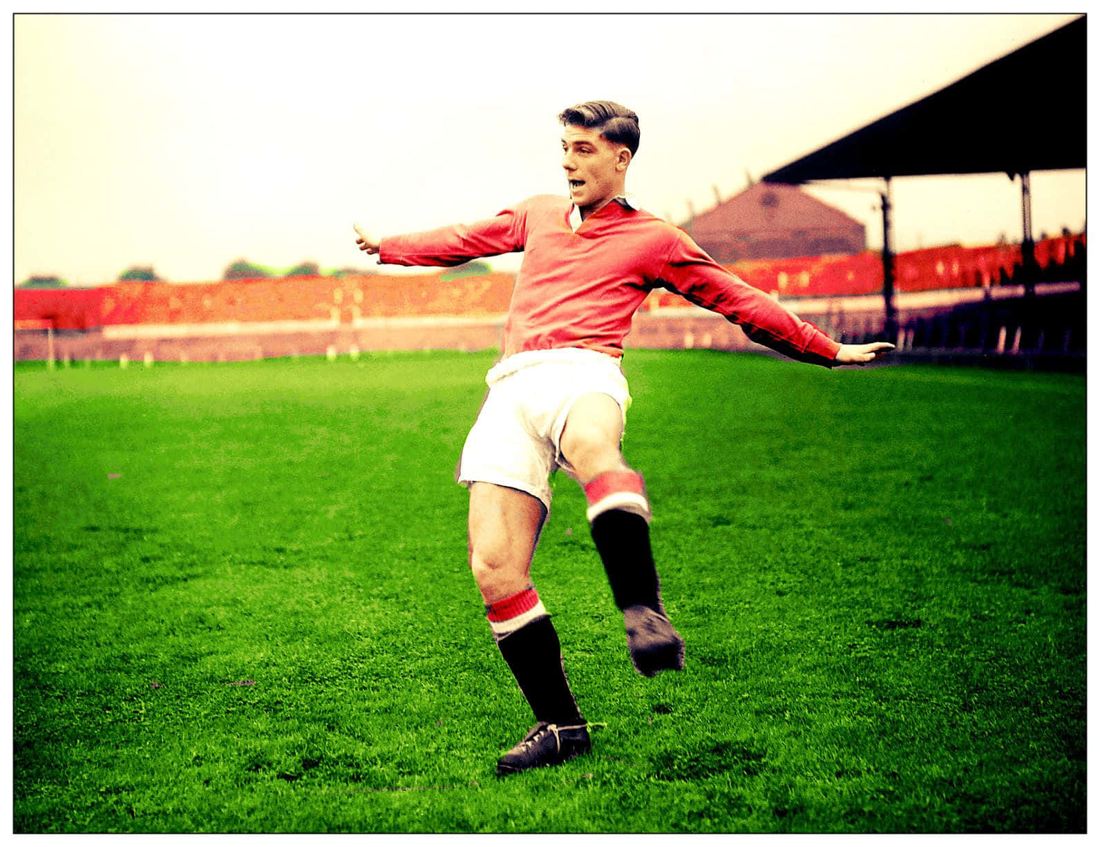 Caption: British Soccer Icon Duncan Edwards In Action Background