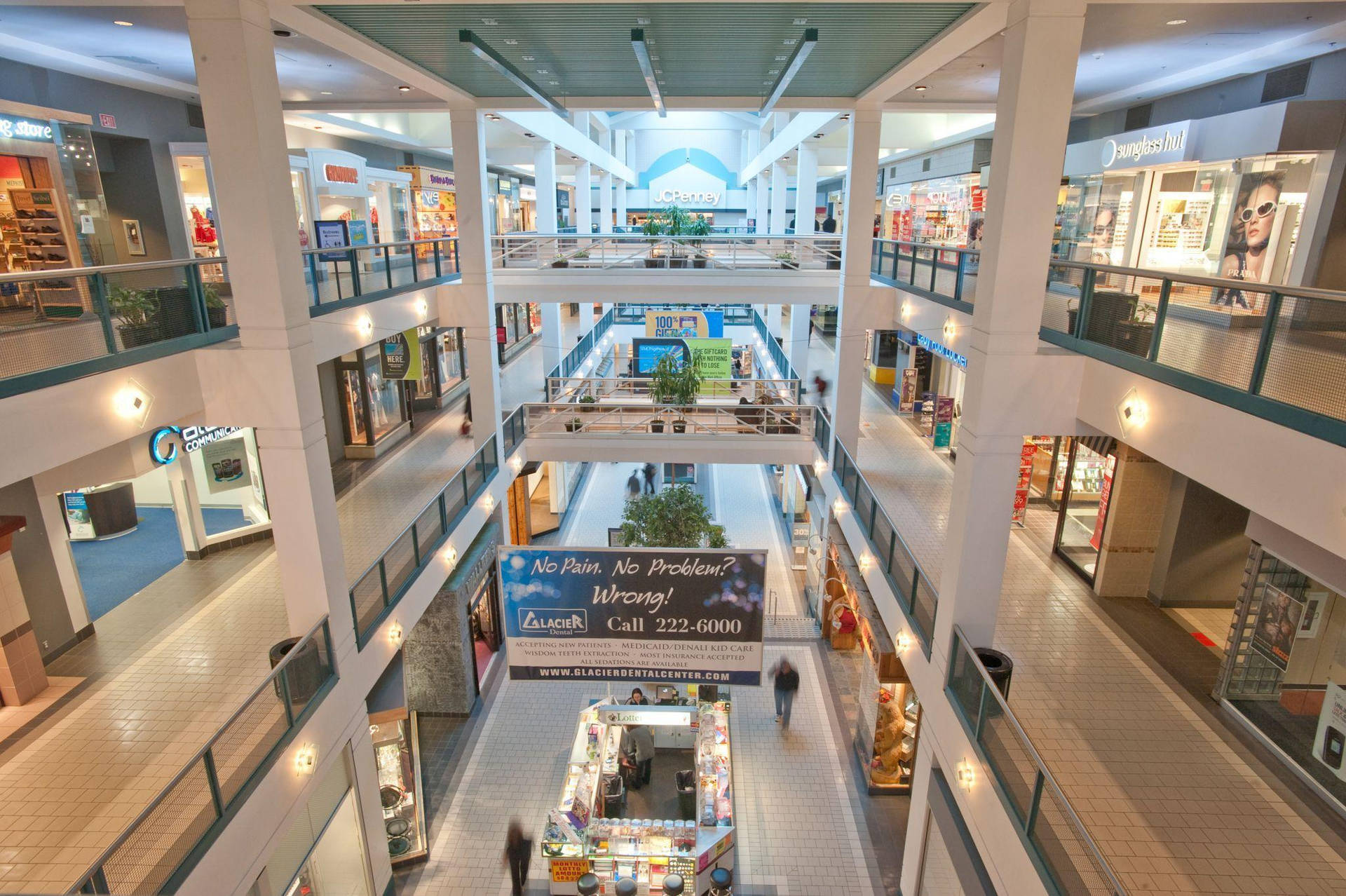 Caption: Bustling Shopping Mall In Anchorage Background