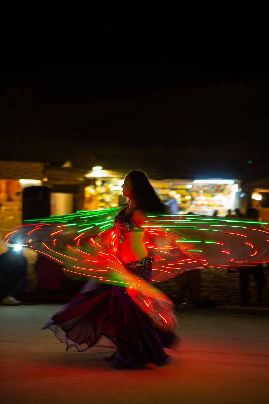 Caption: Captivating Belly Dance Pose In Motion Background