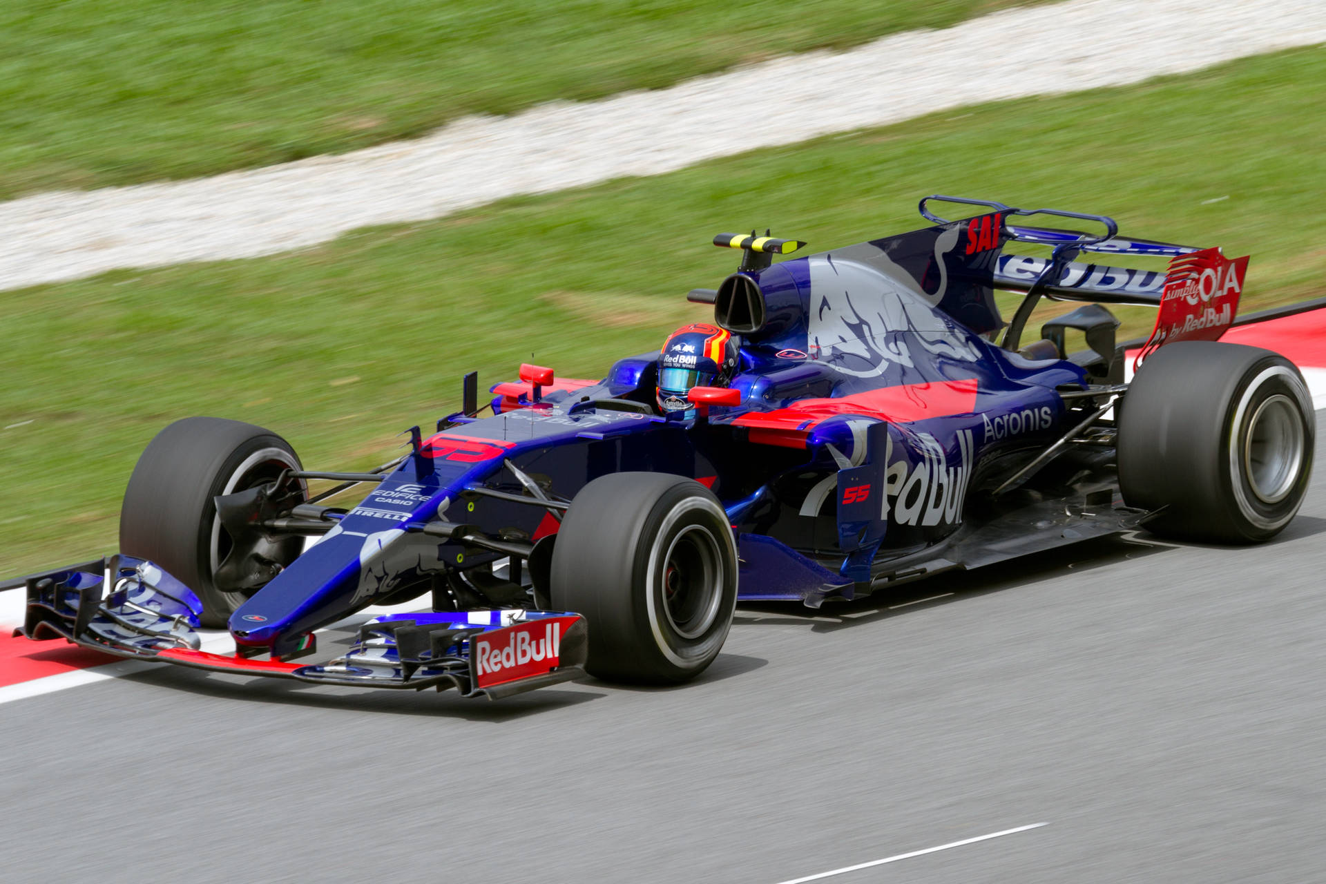 Caption: Carlos Sainz Jr Driving Toro Rosso Str12