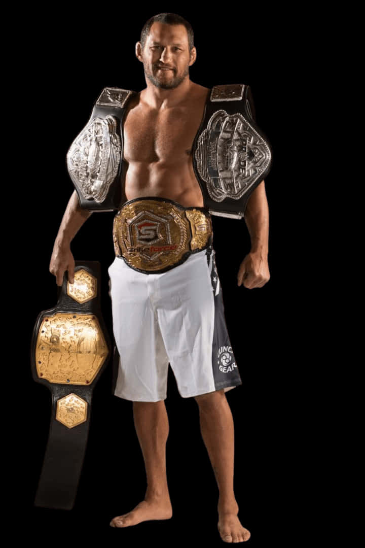 Caption: Champion Dan Henderson Flaunting His Championship Belts Background