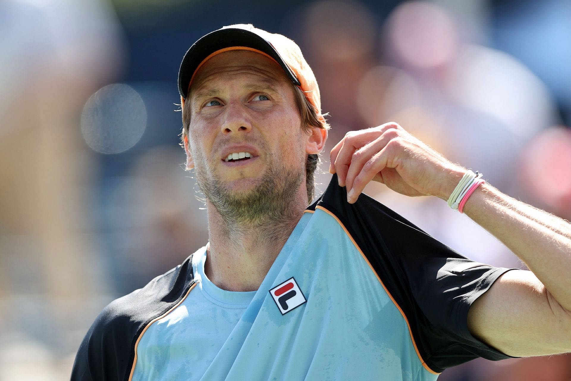 Caption: Champion Tennis Player Andreas Seppi, Proudly Holding His Shirt