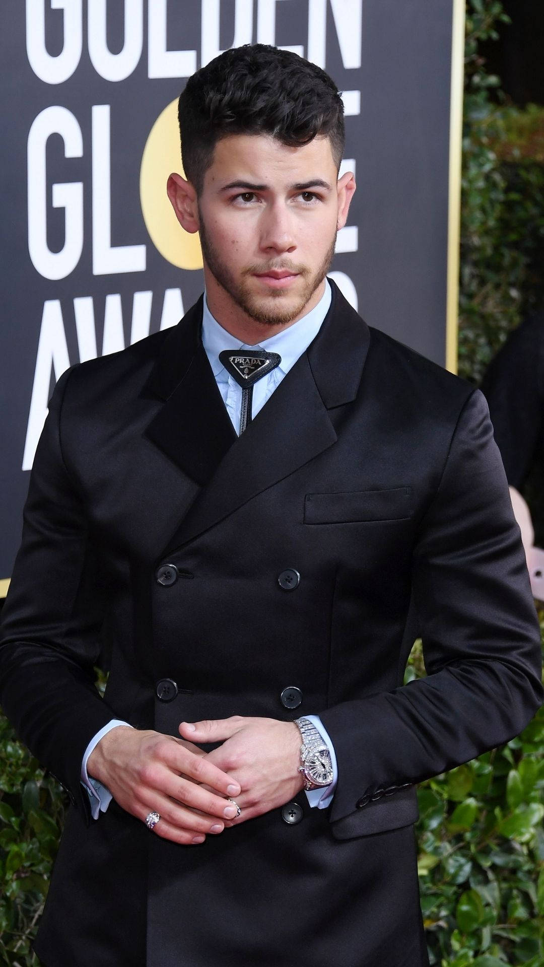 Caption: Charismatic Nick Jonas Slays In Chic Black Suit Background