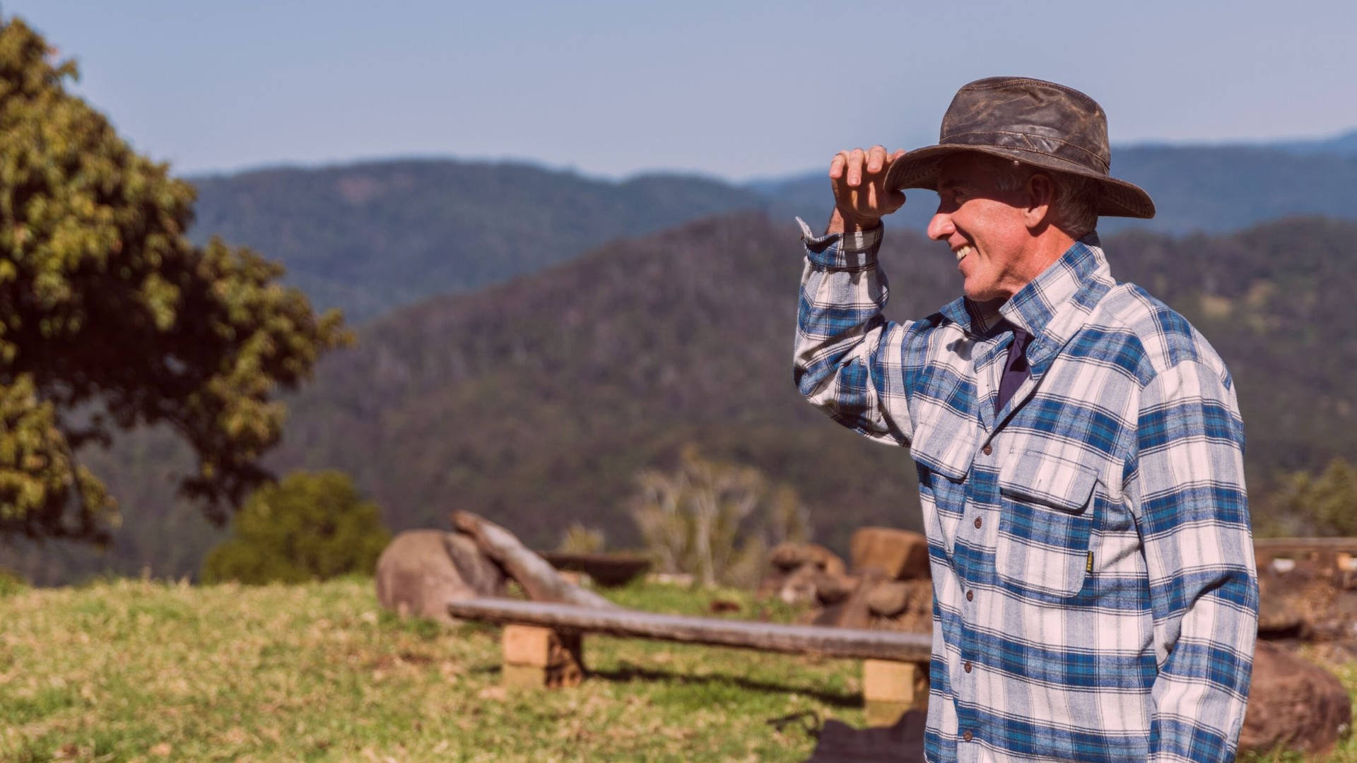 Caption: Cheerful Farmer Enjoying His Work Background