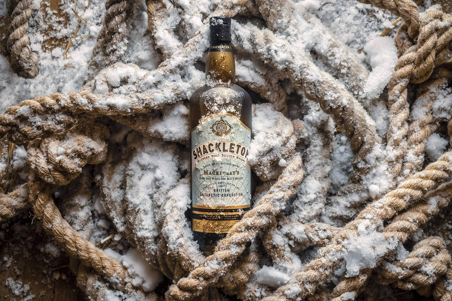 Caption: Chilled Shackleton Whisky In An Arctic Setting Background