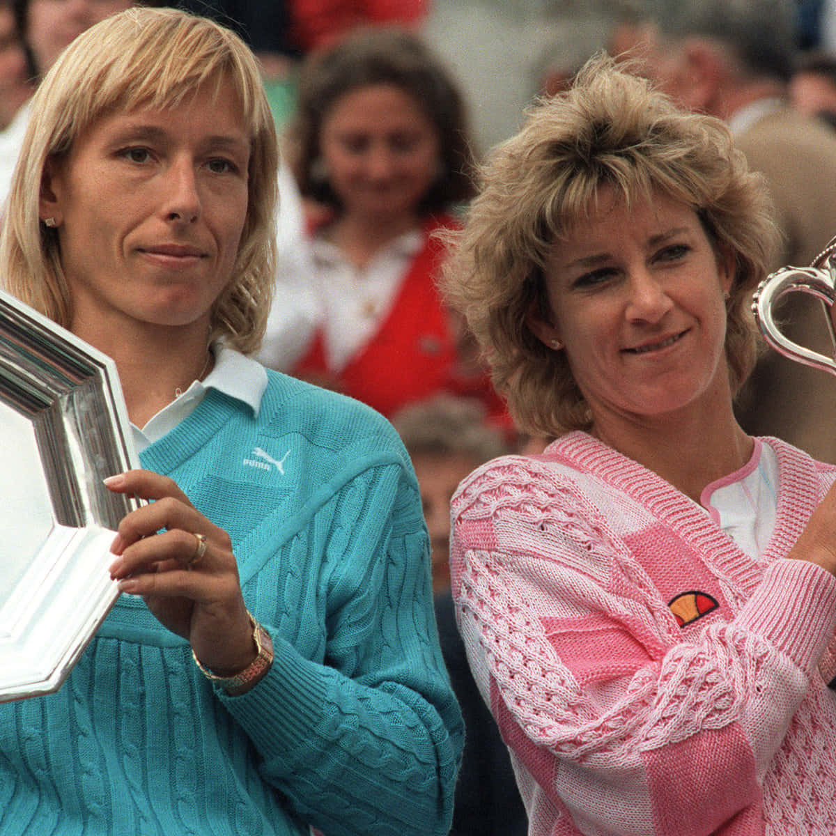 Caption: Chris Evert And Martina Navratilova Posed Together Background