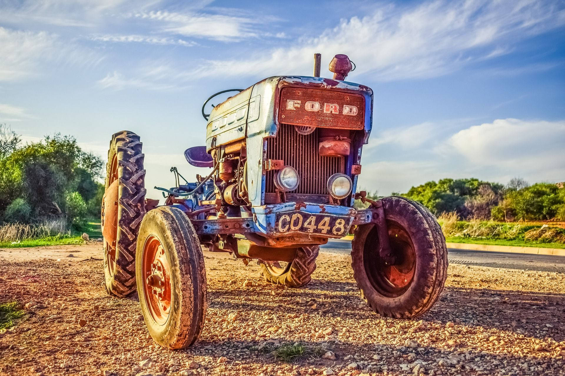 Caption: Classic Ford Tractor In The Field Background