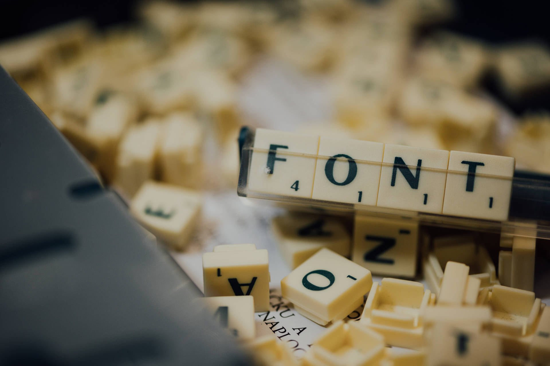 Caption: Close-up Of Scrabble Tiles Spelling 