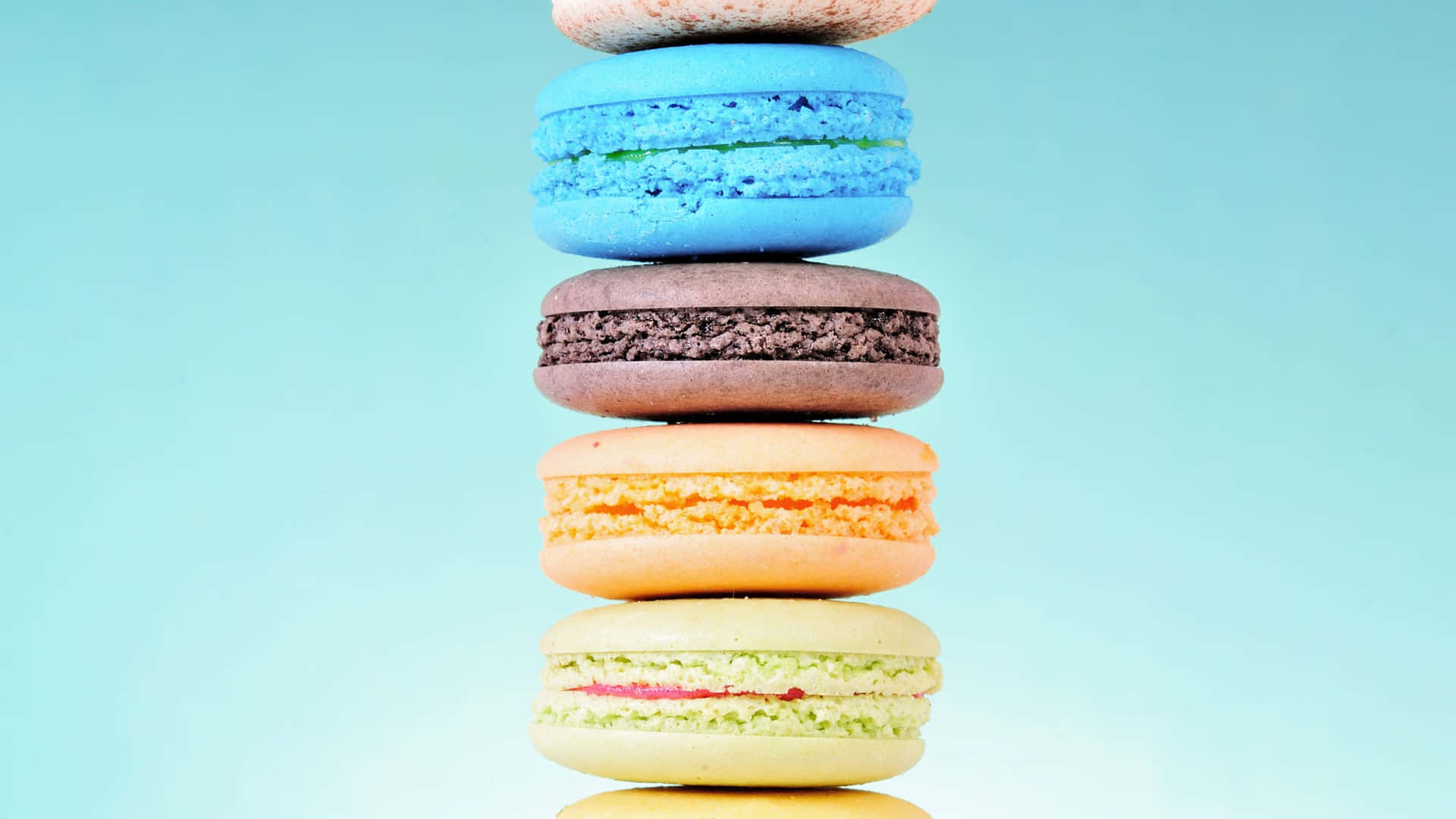 Caption: Colorful And Tasty Macaron Desserts In High Definition Background