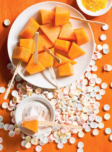 Caption: Colorful Candy Coated Cantaloupe Background