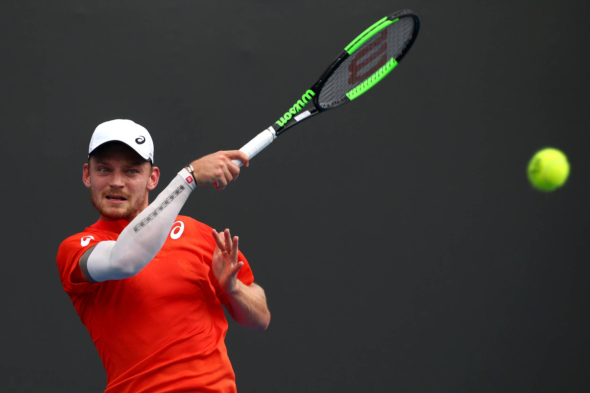 Caption: David Goffin Perfecting A Backhand Stroke Background