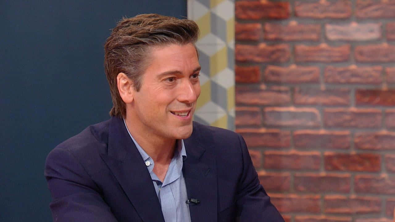 Caption: David Muir During An Appearance On The Rachael Ray Show. Background