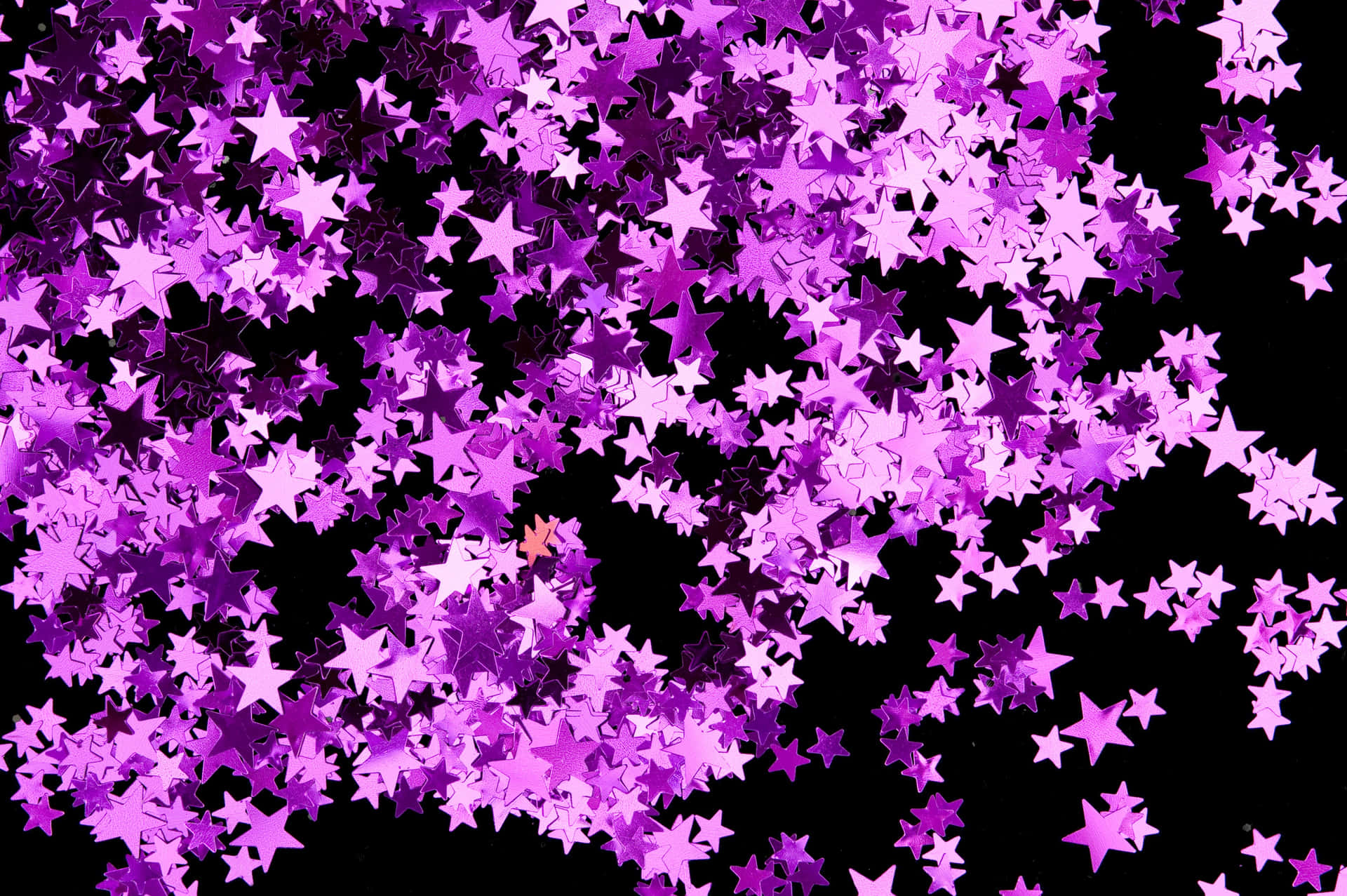 Caption: Dazzling Pink Stars In The Sky Background