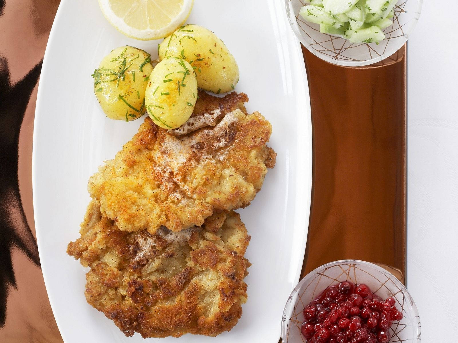 Caption: Delectable Wiener Schnitzel Served With Tasty Marble Potatoes Background