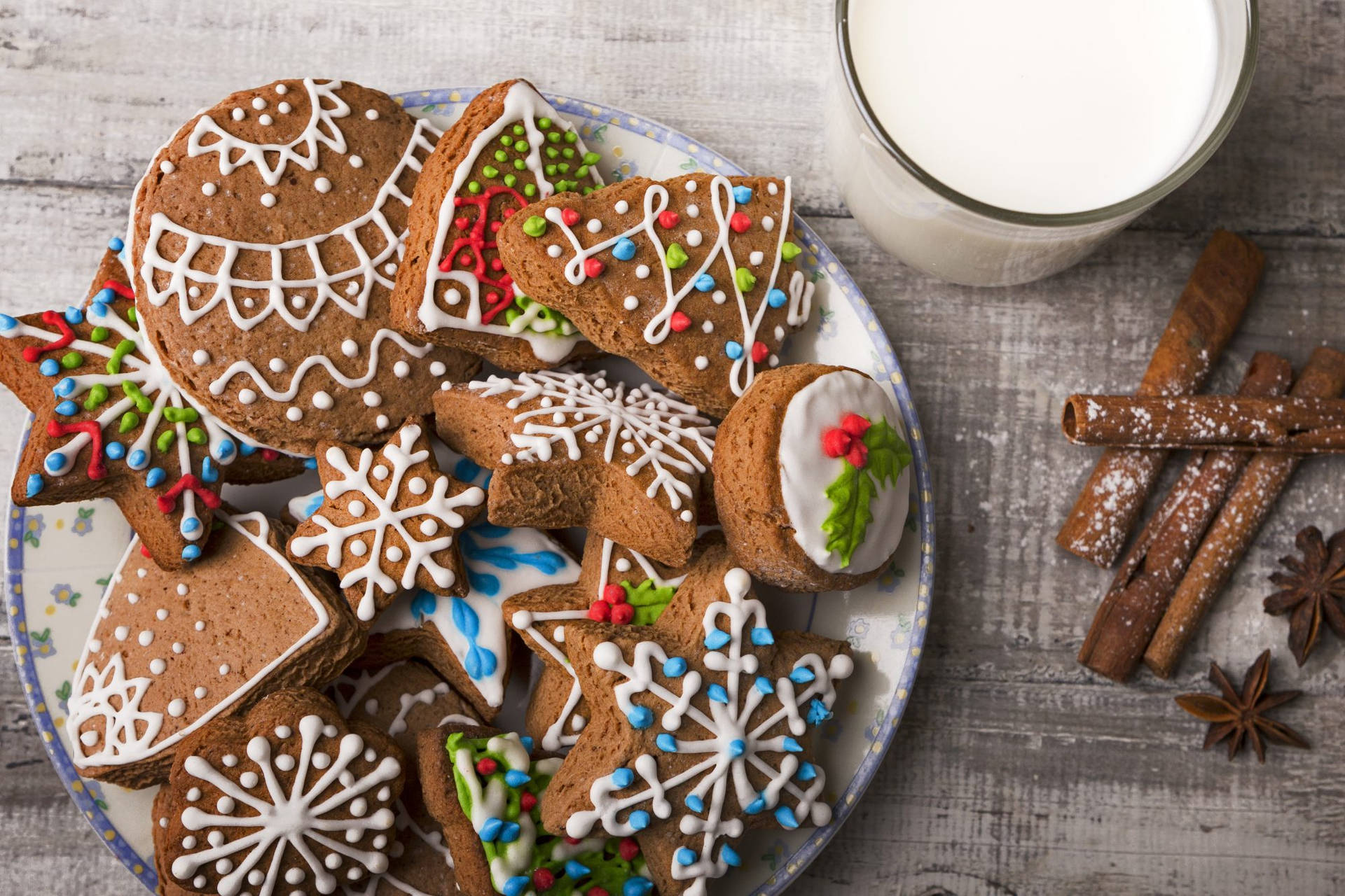 Caption: Delicious Christmas Cookies With Milk And Cinnamon Background