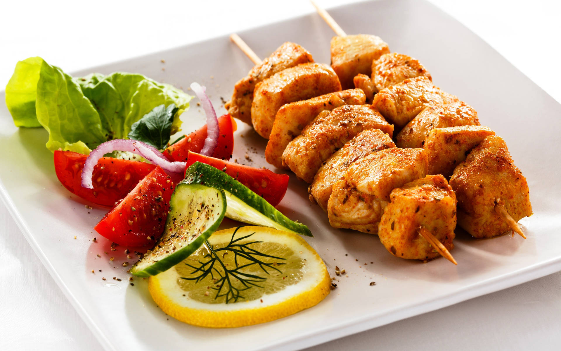 Caption: Delicious Churrasco With Fresh Green Salad Background