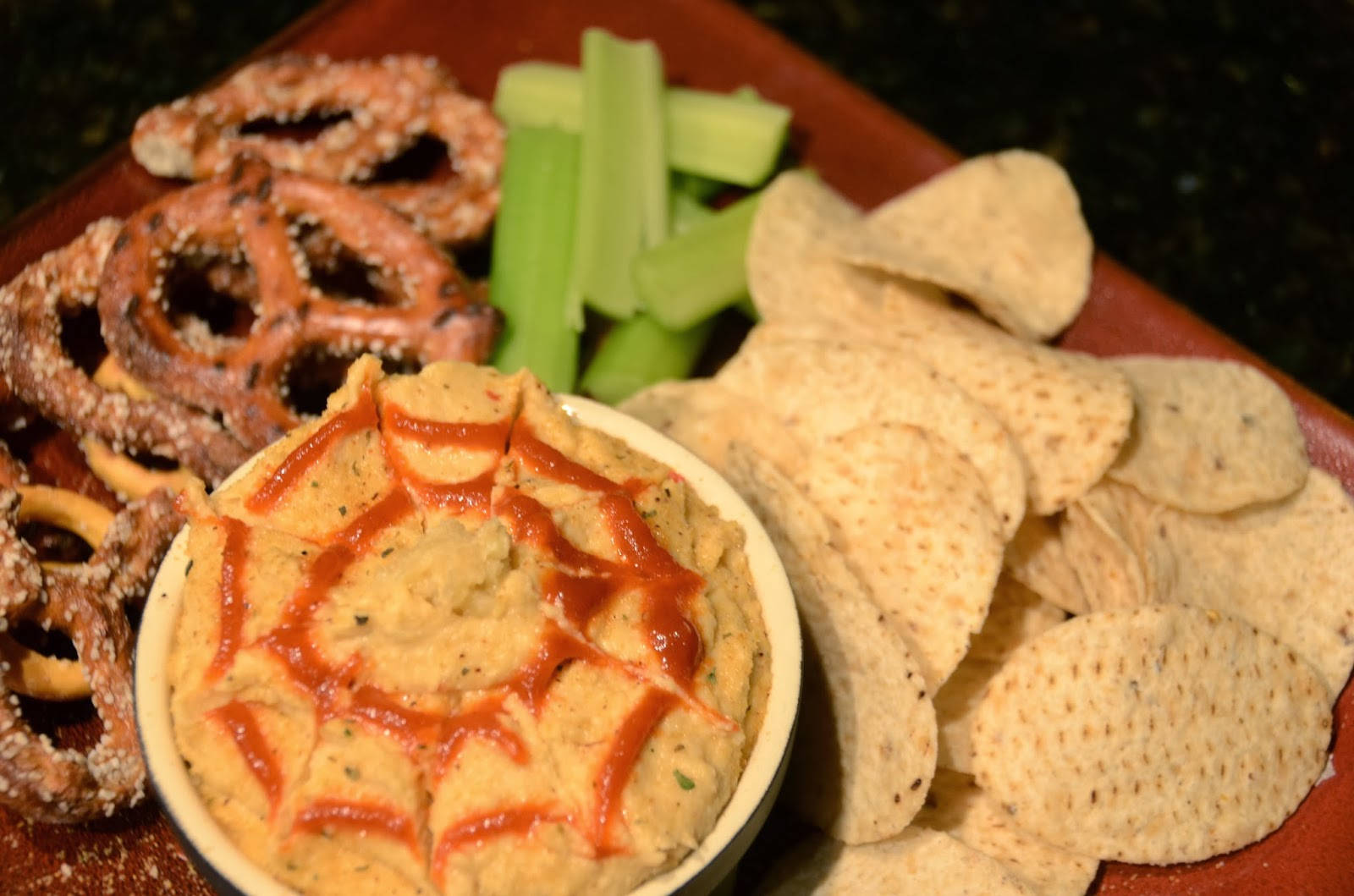 Caption: Delicious Hummus With Chips And Fresh Vegetables Background