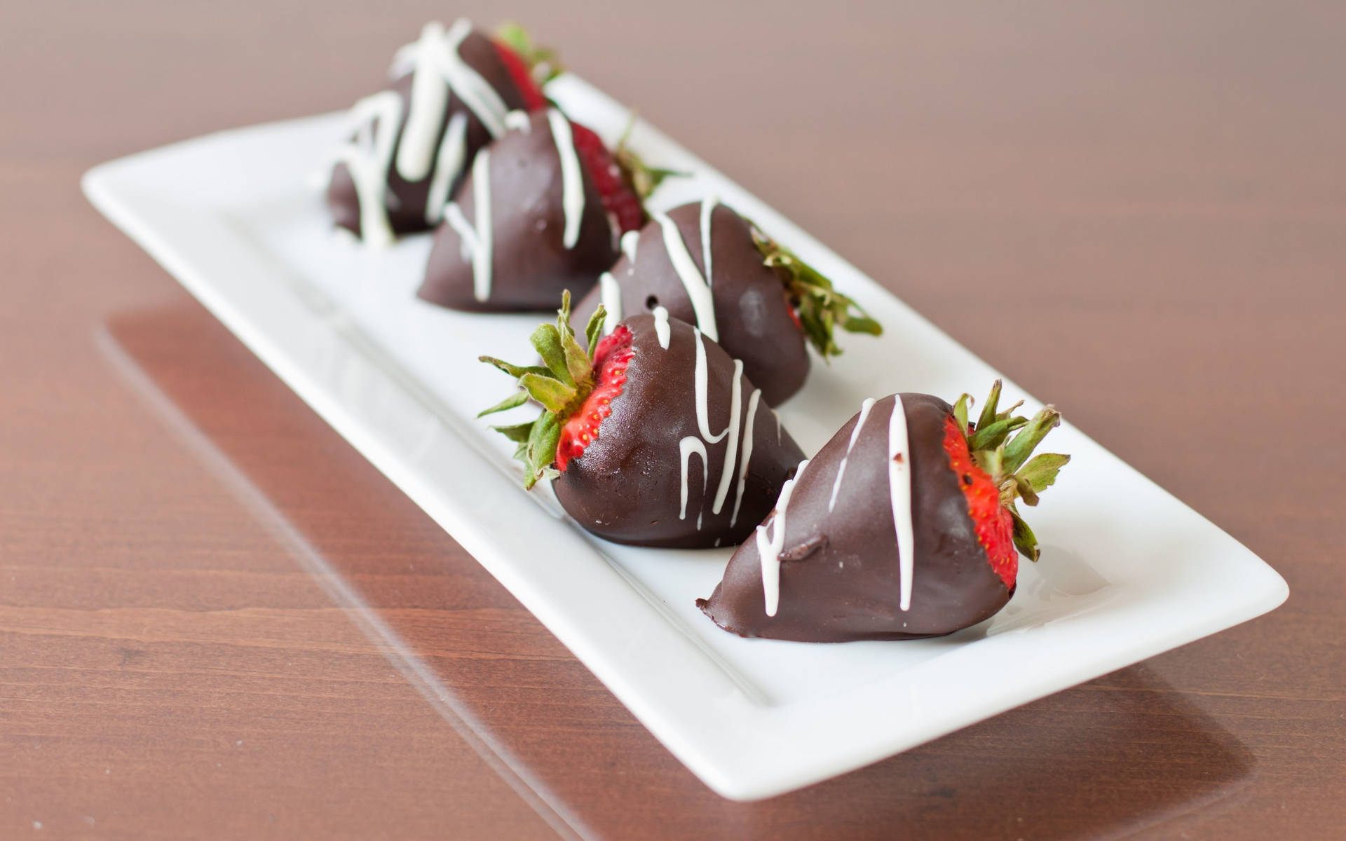 Caption: Delightful Chocolate Dipped Strawberries Background