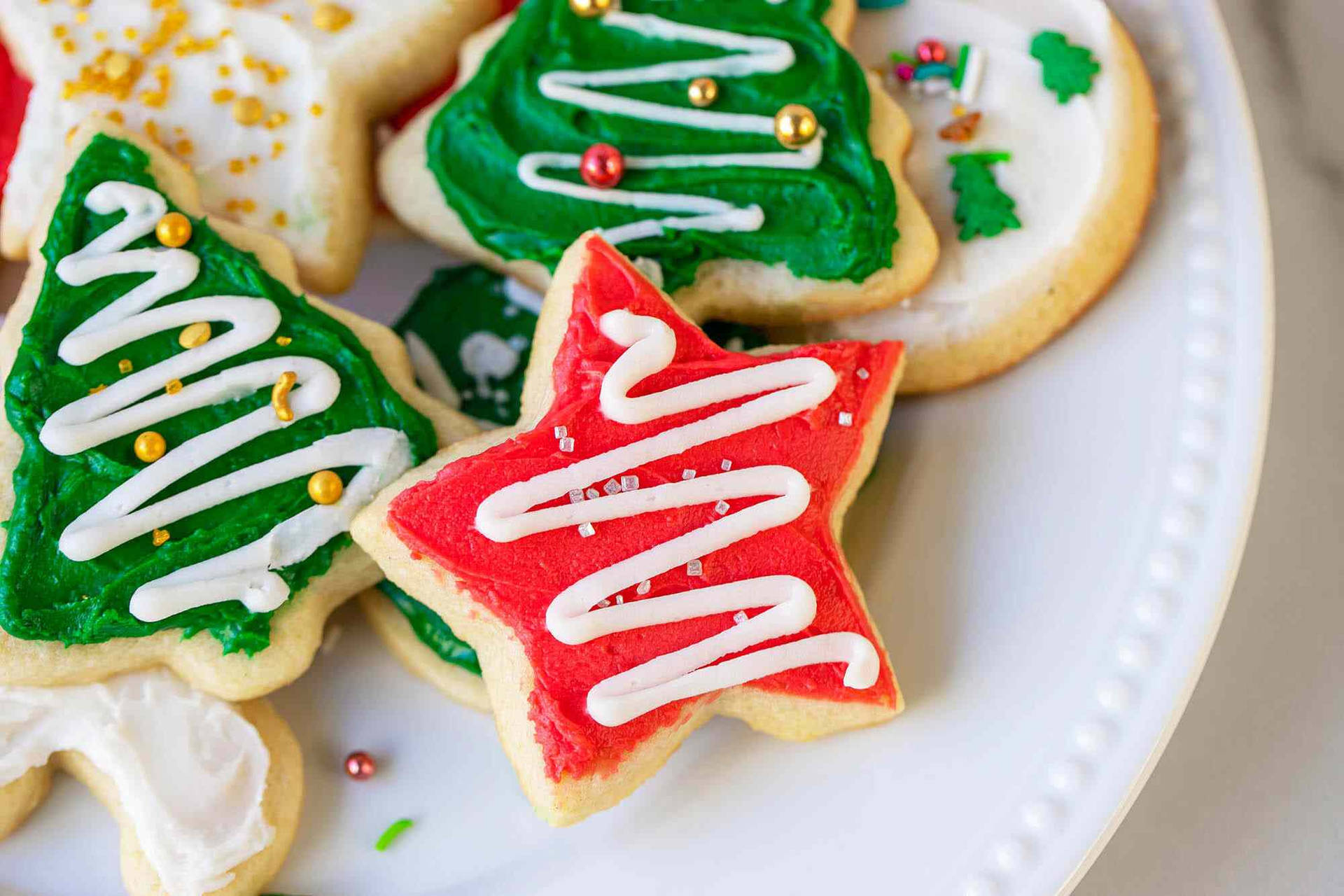 Caption: Delightful Star-shaped Christmas Cookies Background