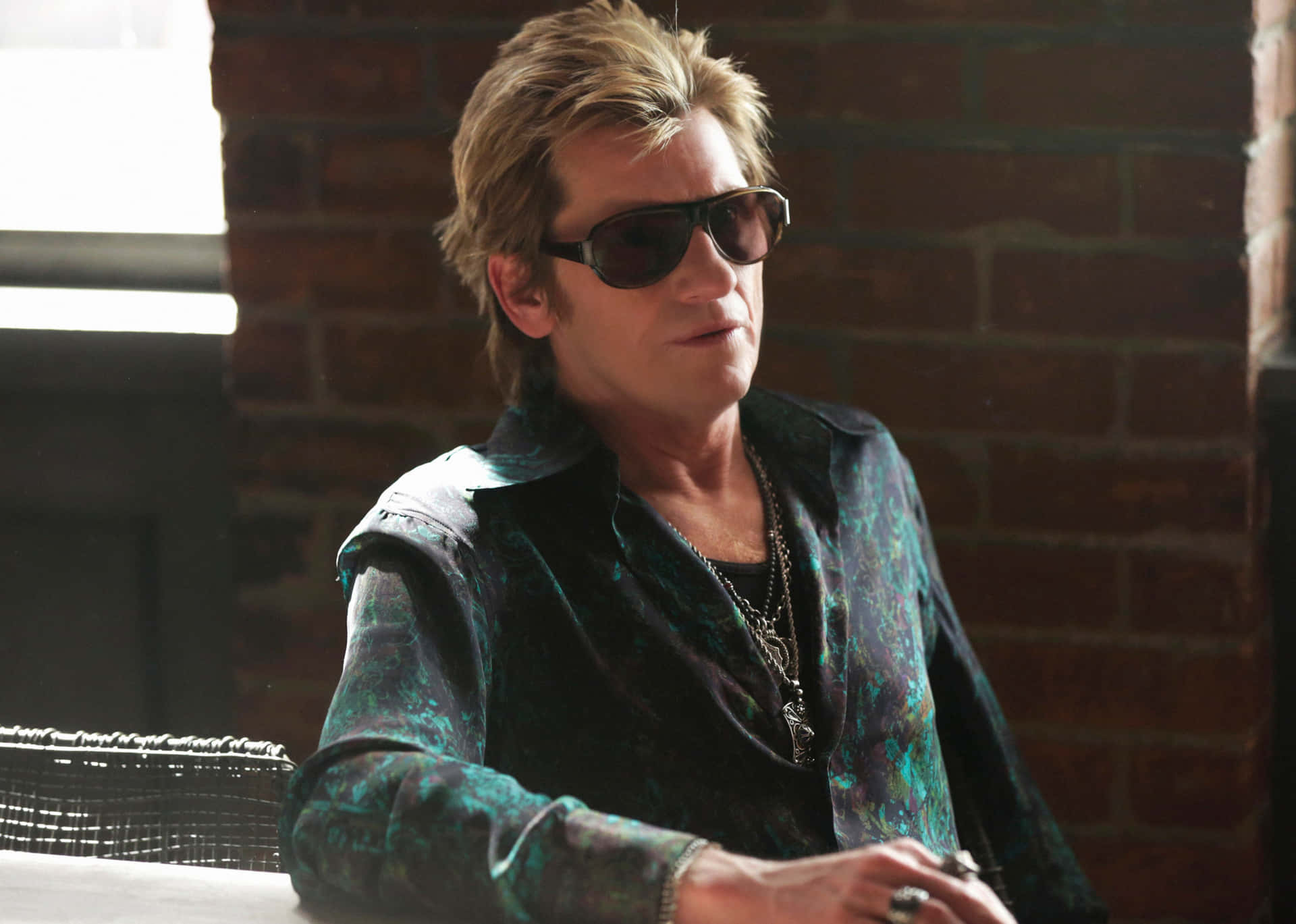 Caption: Denis Leary Contemplating Thoughtfully Background