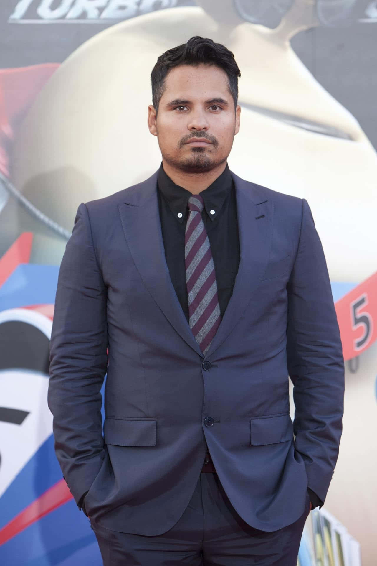 Caption: Distinguished Artist Michael Peña In A Captivating Portrait Background