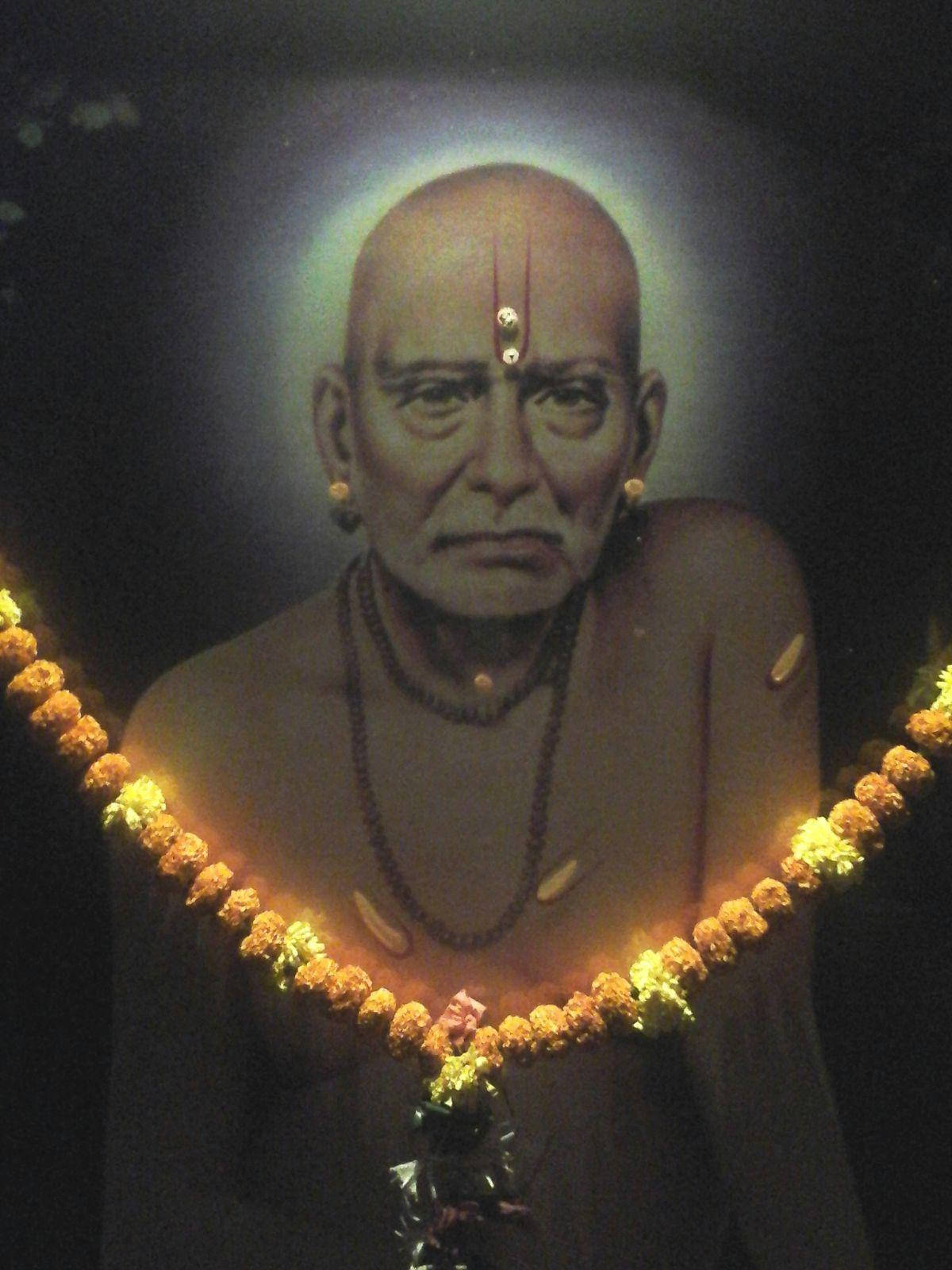 Caption: Divine Portrait Of Shri Swami Samarth Adorned With Garland Background