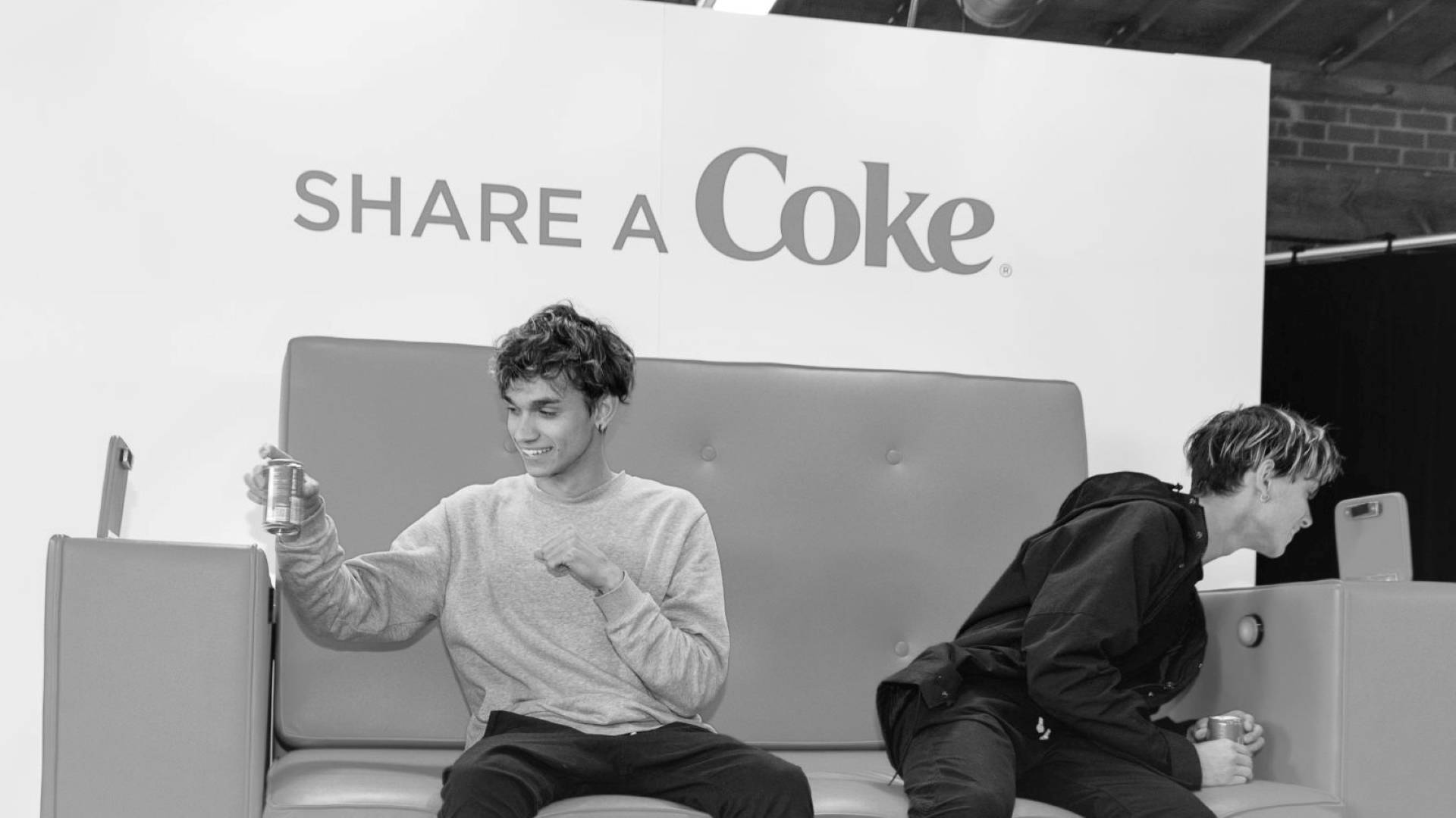 Caption: Dobre Brothers Enjoying 'share A Coke' Day Background