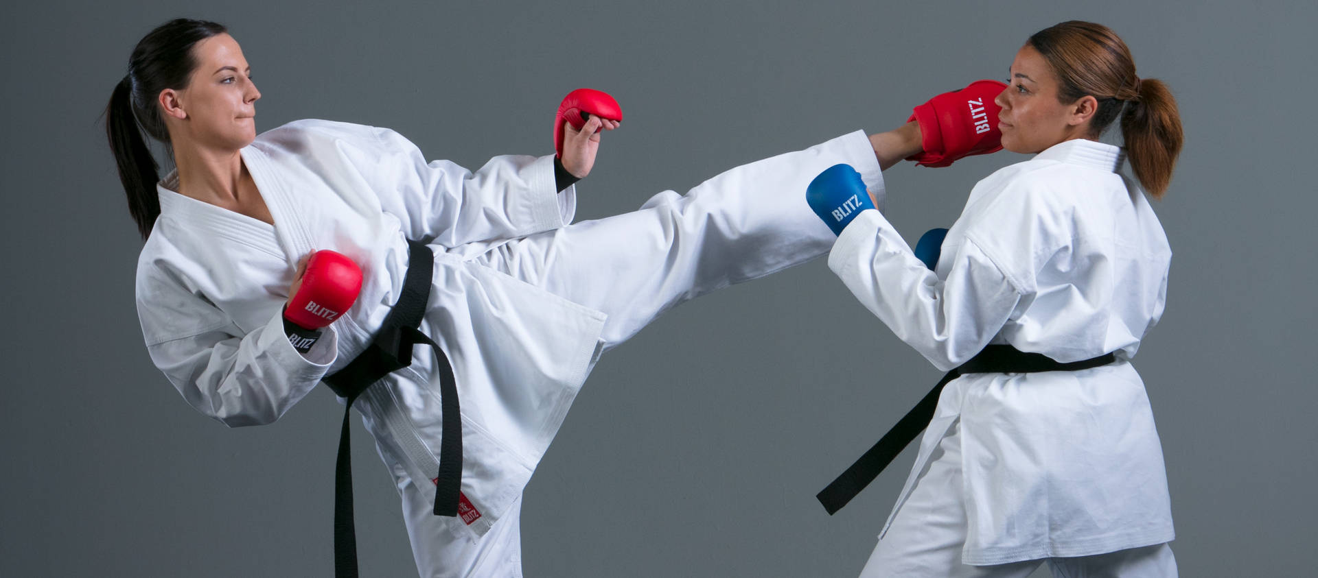 Caption: Dynamic Karate Action Between Two Female Martial Artists