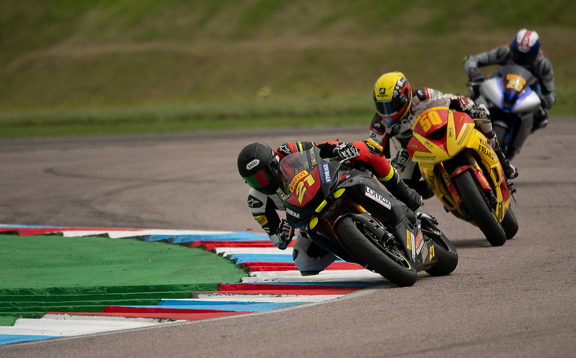 Caption: Dynamic Superbike Racing On Track