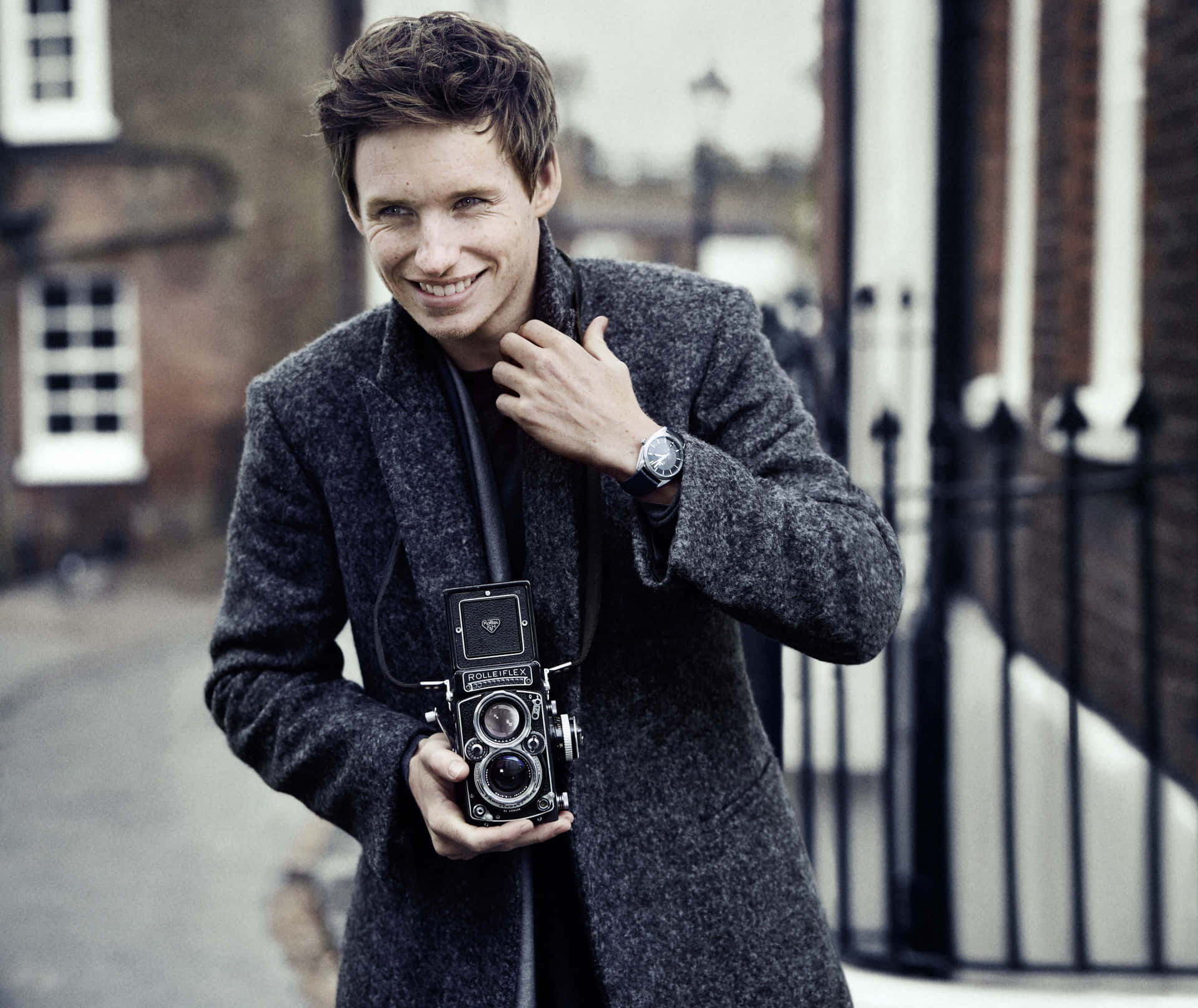 Caption: Eddie Redmayne Displaying His Charismatic Charm In A Casual Ensemble Background