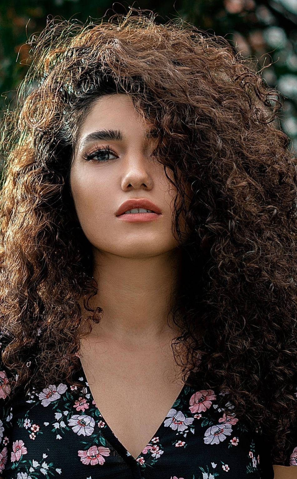 Caption: Effortless Beauty - Girl With Luscious Curly Hair Background