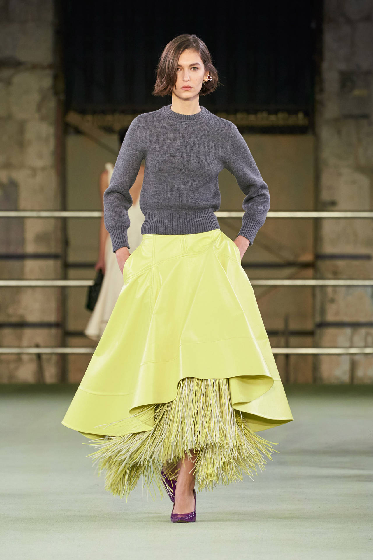 Caption: Elegance In Fashion - Model Wearing Yellow Bottega Veneta Skirt