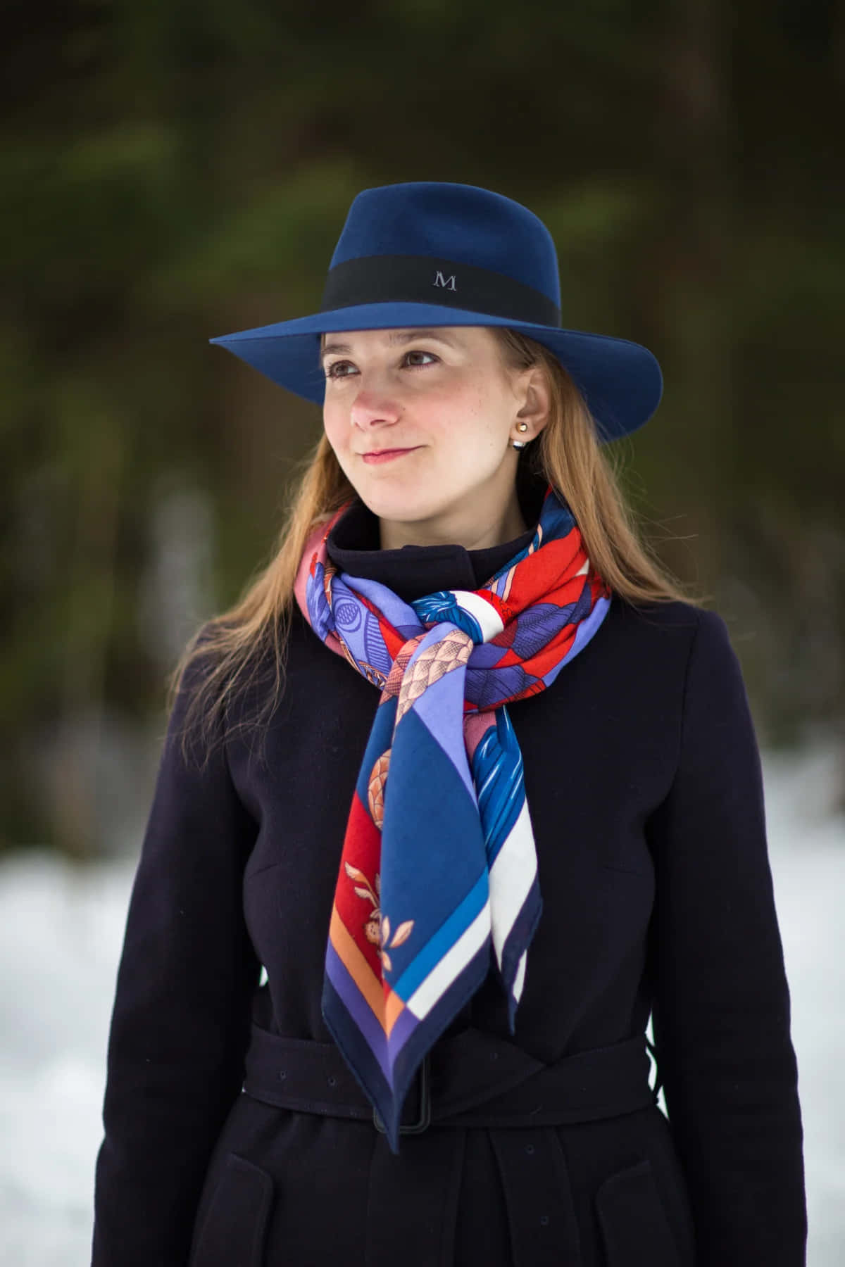 Caption: Elegant Azure Fedora By Maison Michel Background
