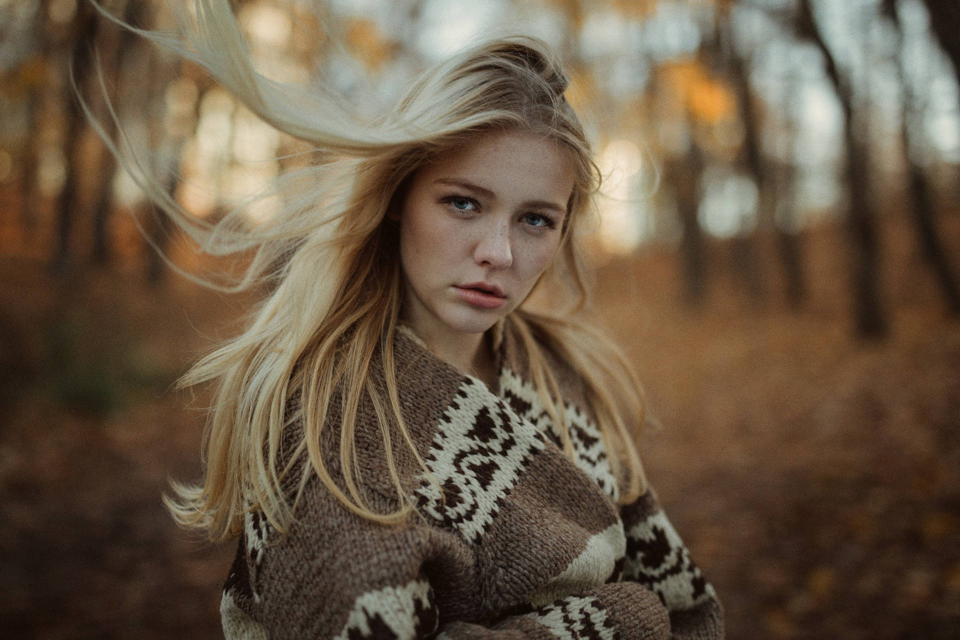 Caption: Elegant Blonde Woman Embracing Fall Fashion Background